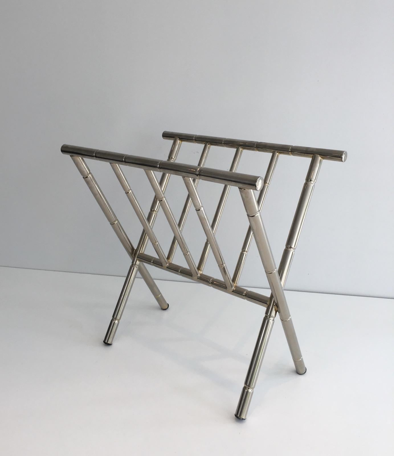 This magazine rack is made of nickel. This is a nice work imitating faux-bamboo, in the style of famous French designer Jacques Adnet, circa 1970.