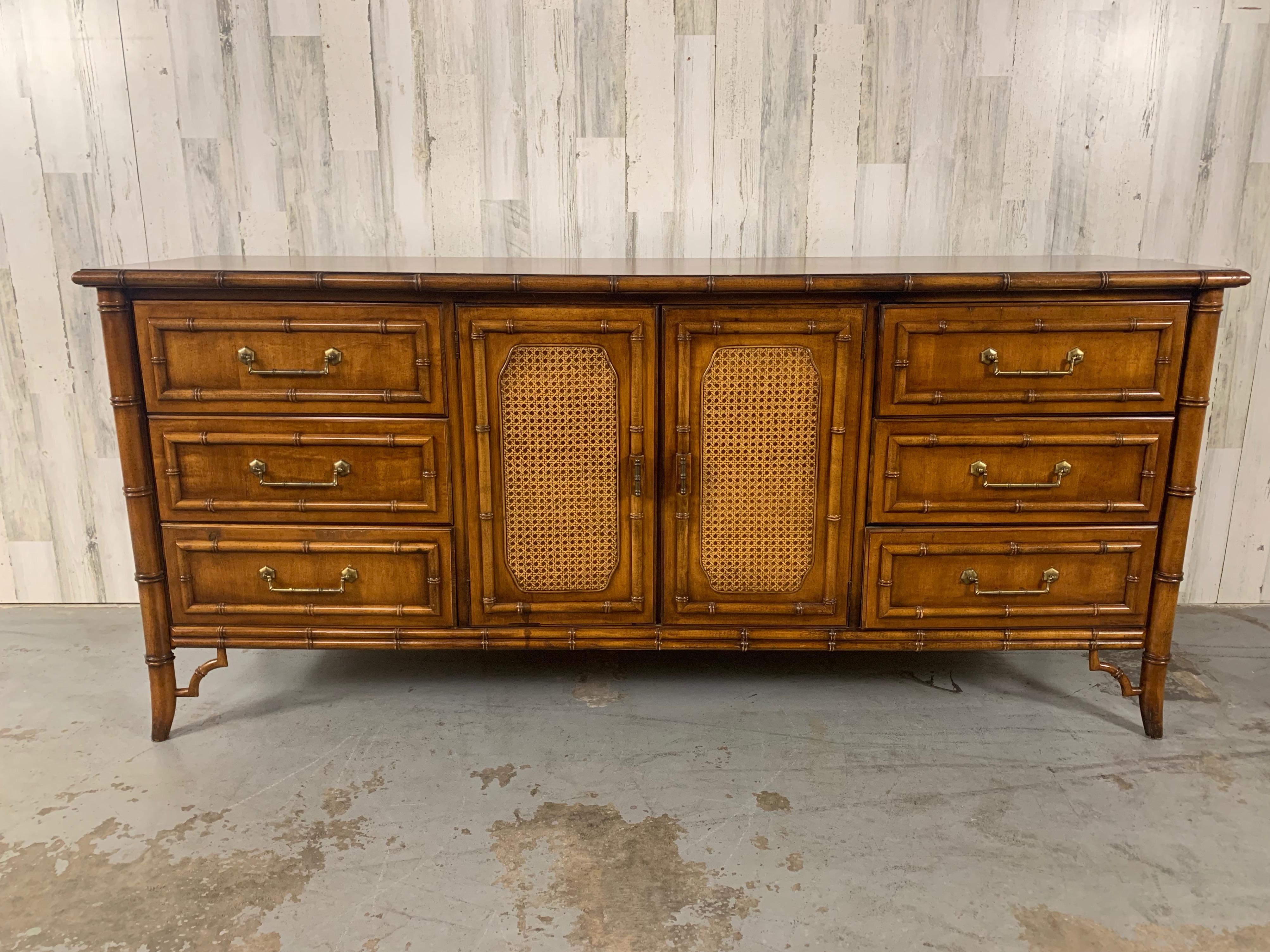 Plenty of storage in this nine drawer dresser by Dixie furniture. Nicely detailed 