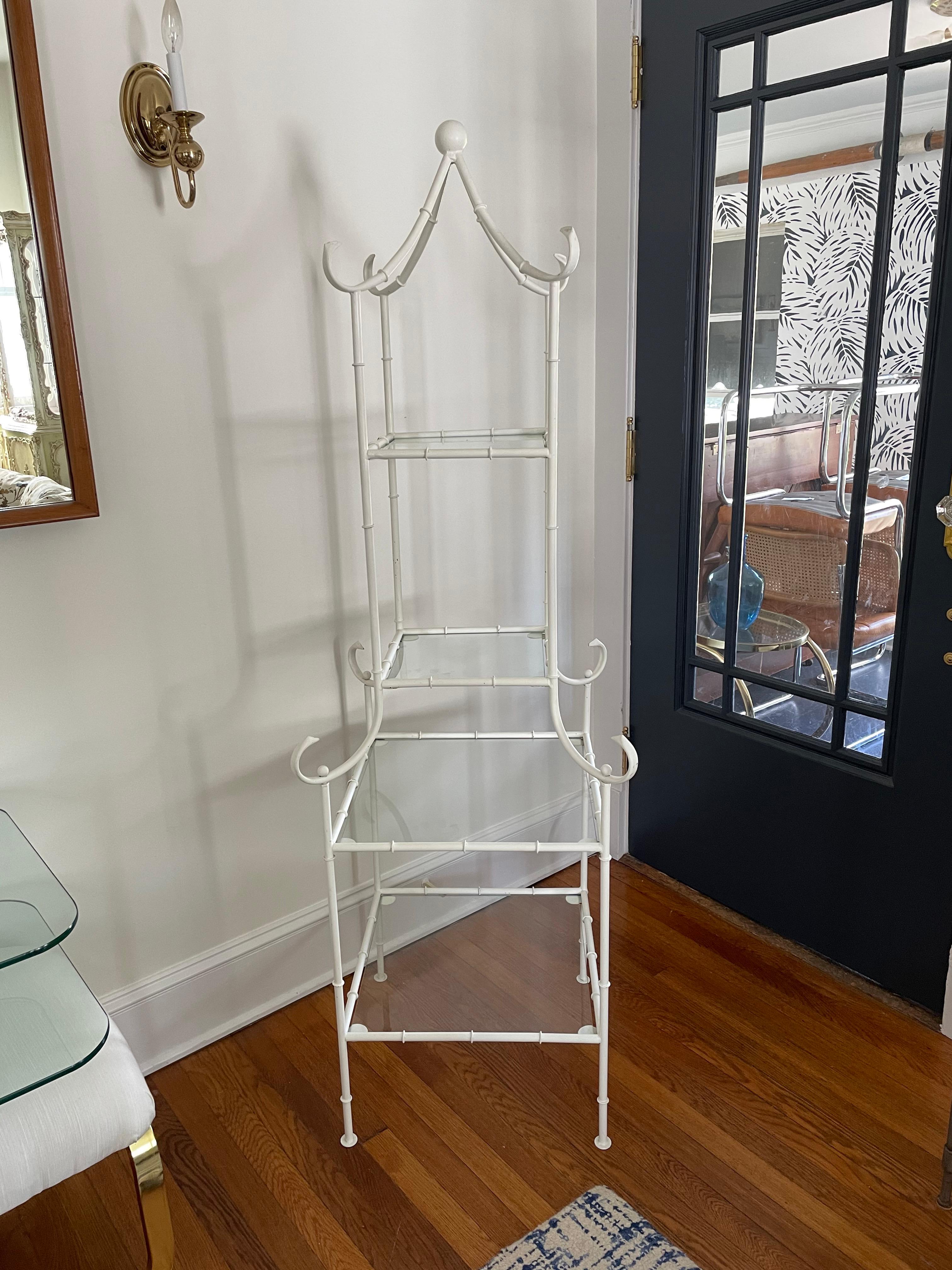 Pagoda form faux bamboo etagere in painted metal with four removable glass shelves. 
Curbside to NYC/Philly $400