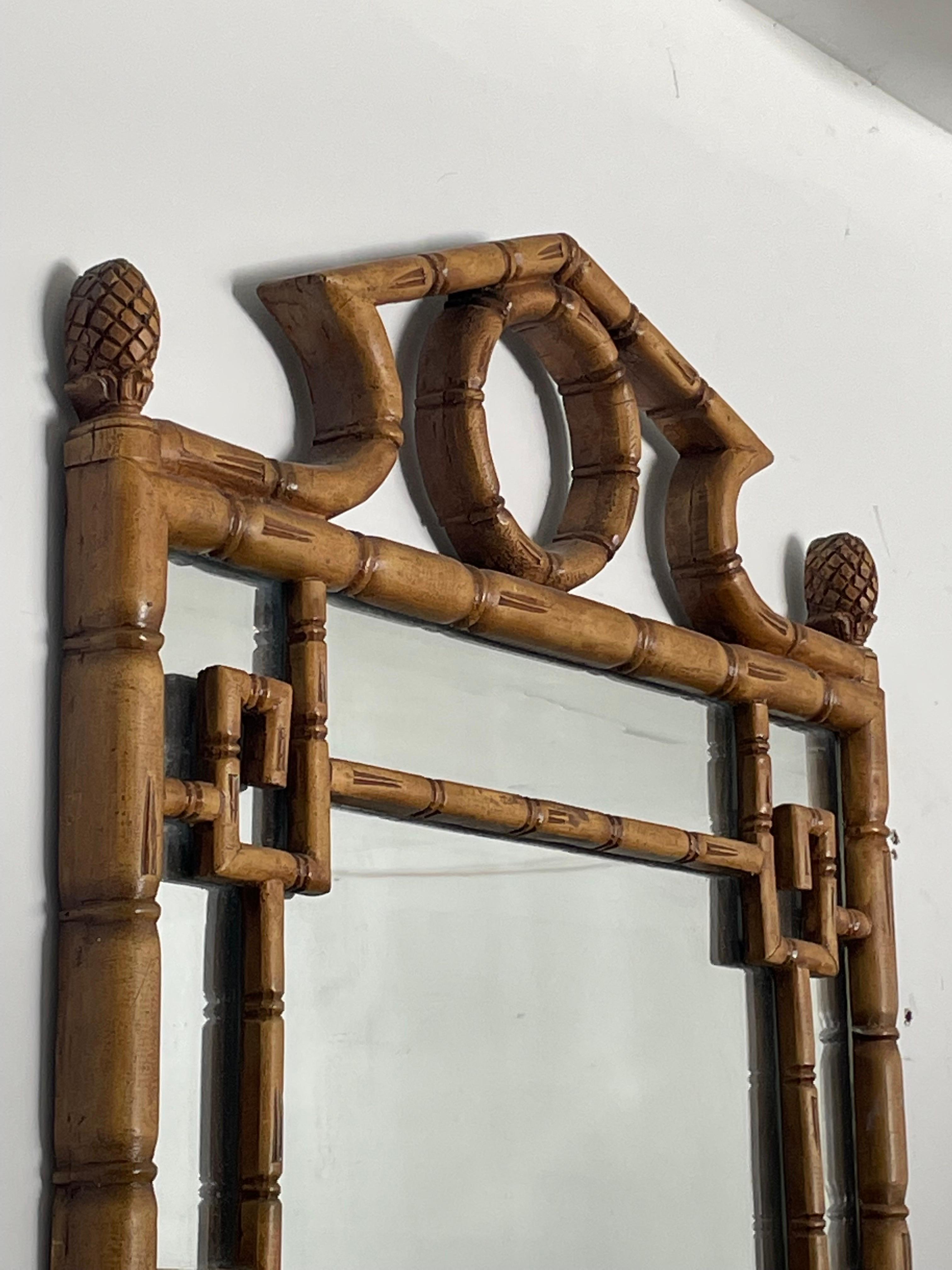 A large scale faux bamboo pagoda mirror with greek key motif. A truly gorgeous piece intended to complete any room. Mirror is exceptionally heavy (30-35lb estimate) and well built.