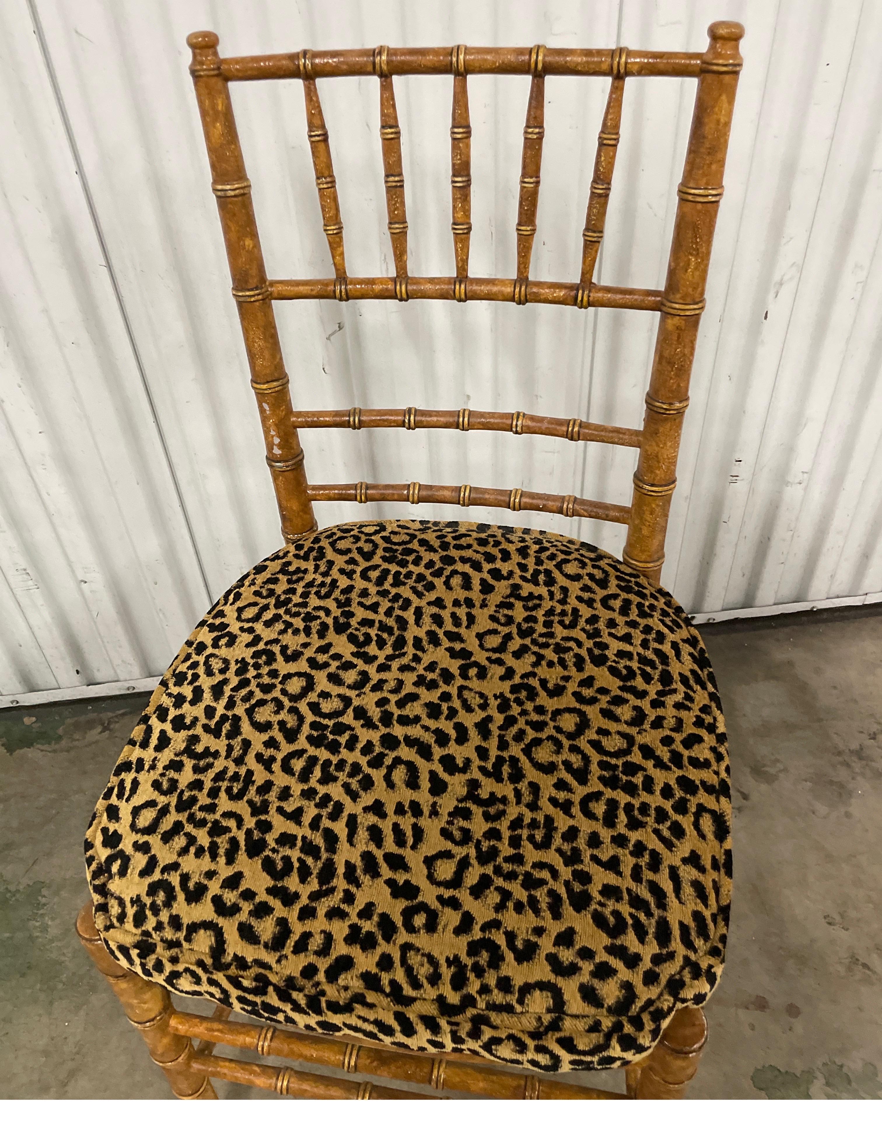 Vintage faux bamboo tortoise painted Chiavari style side chair with leopard print seat cushion.