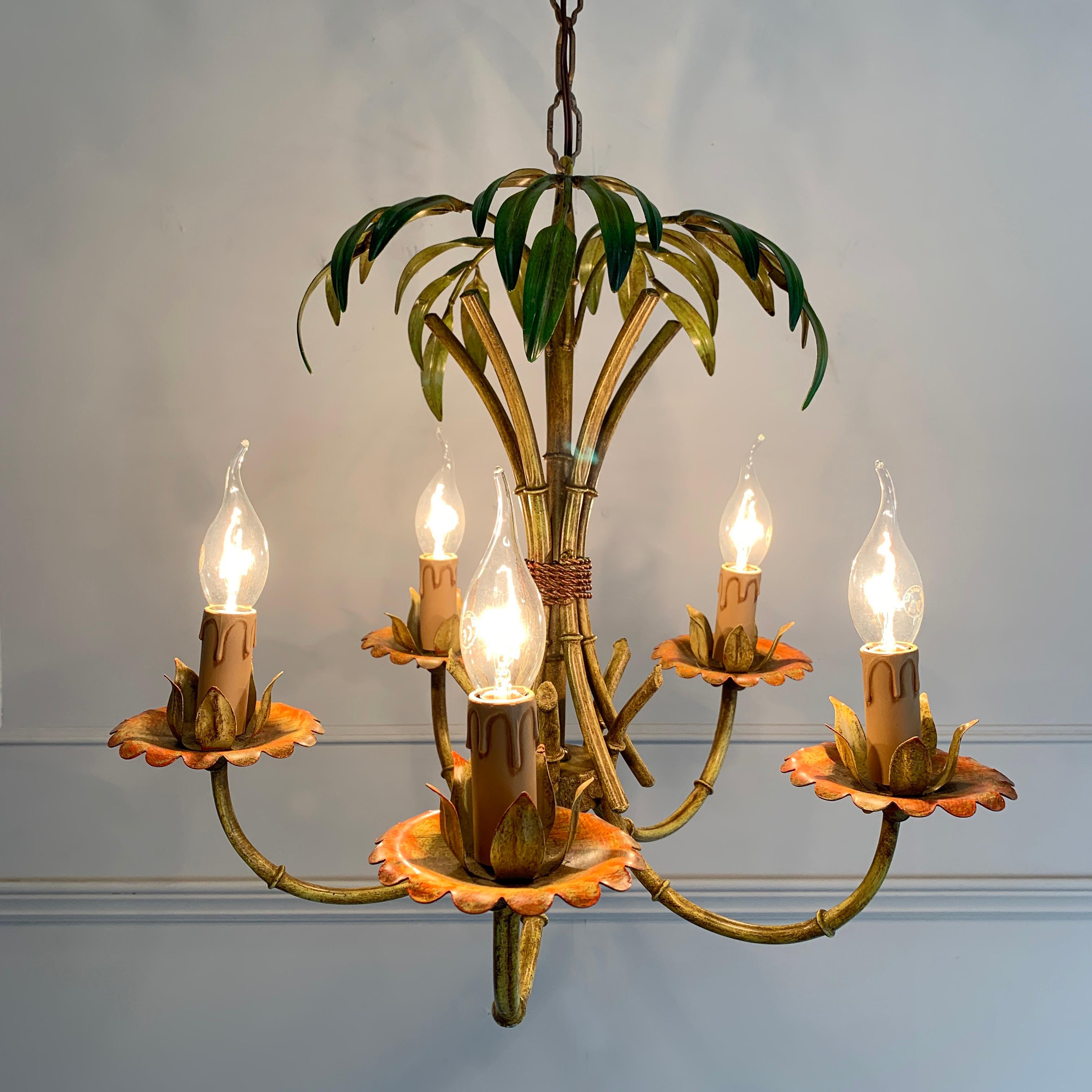 Faux bamboo palm chandelier, circa 1970s
Bright strong hand painted green and orange tones across this faux bamboo palm light
The chandelier has 5 lamp holders
A small matching rose sits at the top of the chain
Measures: 99cm total drop, 42cm light