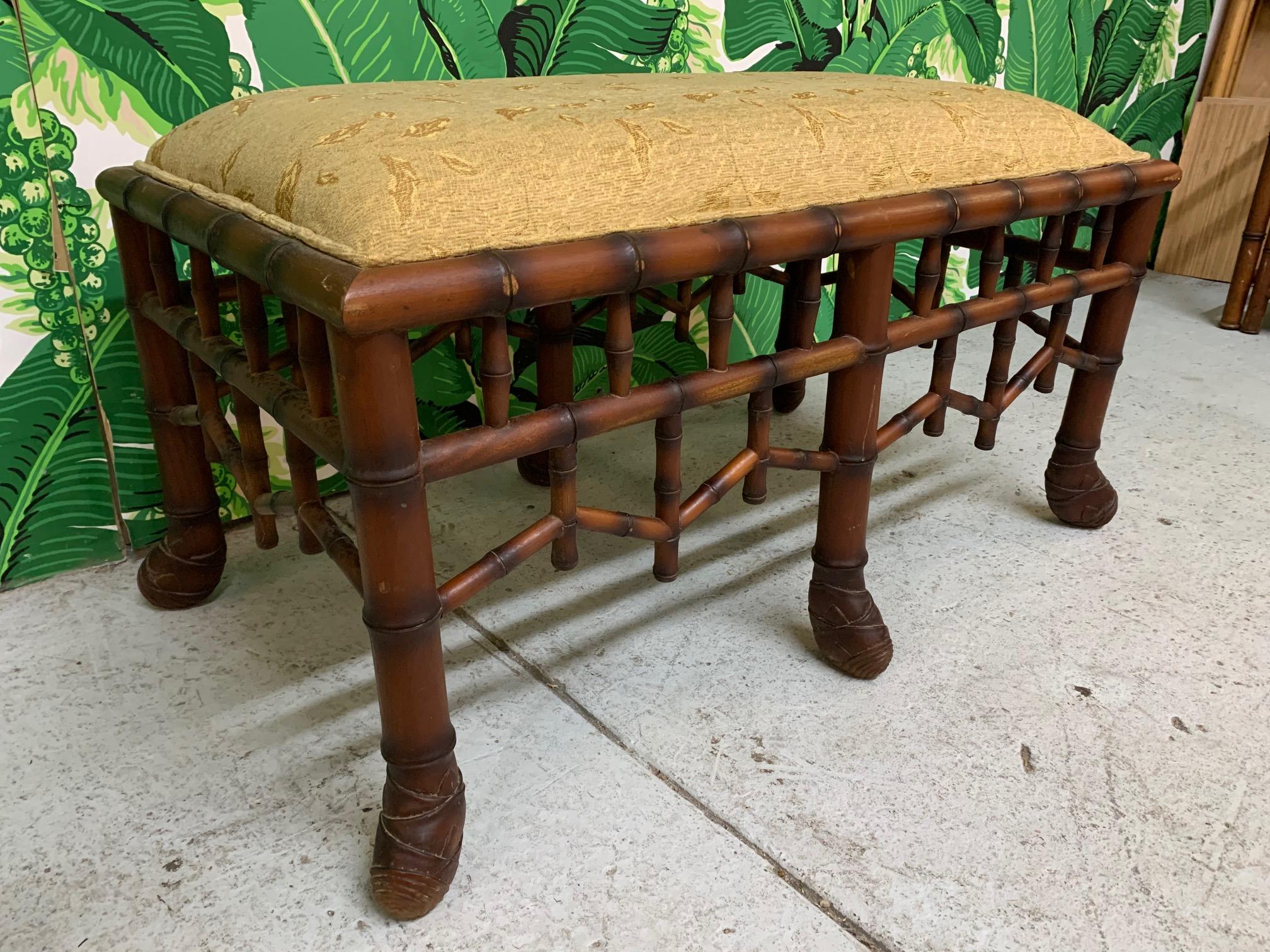 Faux bamboo bench upholstered in gold fabric in the style of Brighton Pavilion seating. Good condition with only minor imperfections consistent with age. May exhibit scuffs, marks, or wear, see photos for details.
For a shipping quote to your exact