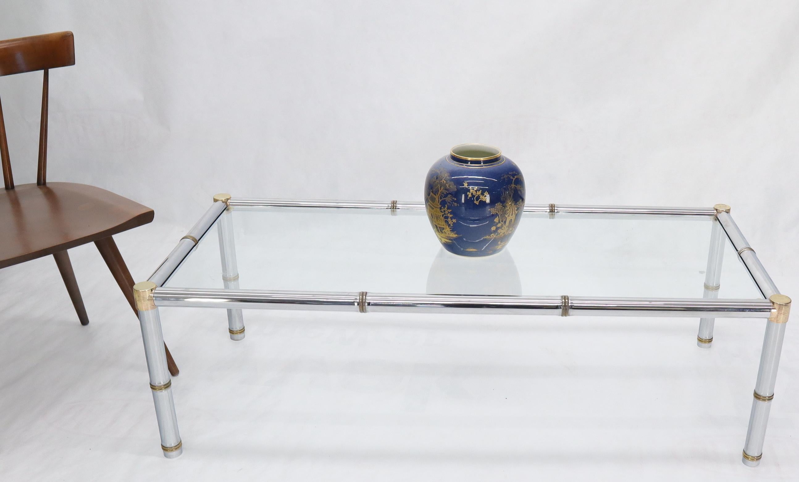 Mid-Century Modern chrome and brass rectangular coffee table with glass top.
