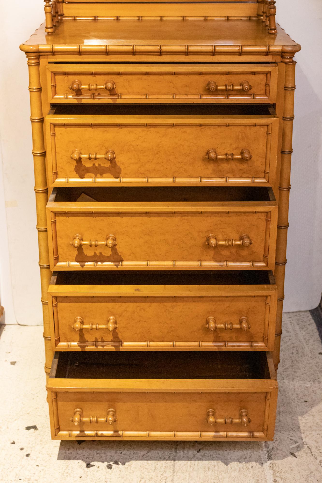 Circa 1870s-1880s faux bamboo Bird's Eye Maple side lock chest by Horner. The five drawer chest is supported by a galleried top that features an adjustable, beveled mirror. Made in the United States. Please note of wear consistent with age. There is
