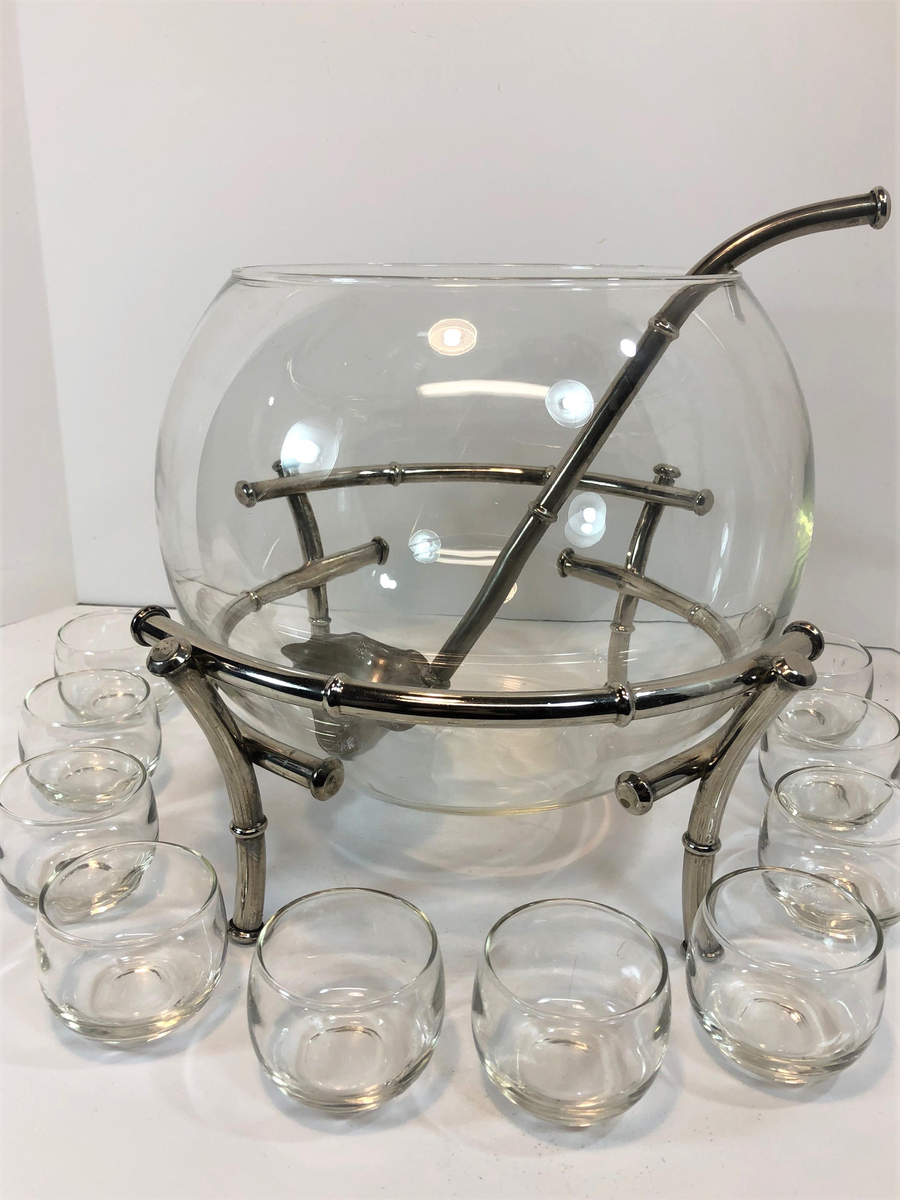 Faux bamboo silver plate punch set with ladle and ten cups. Punch bowl and cups are made of CLEAR glass and in great condition. Set looks to be unused or hardly used.