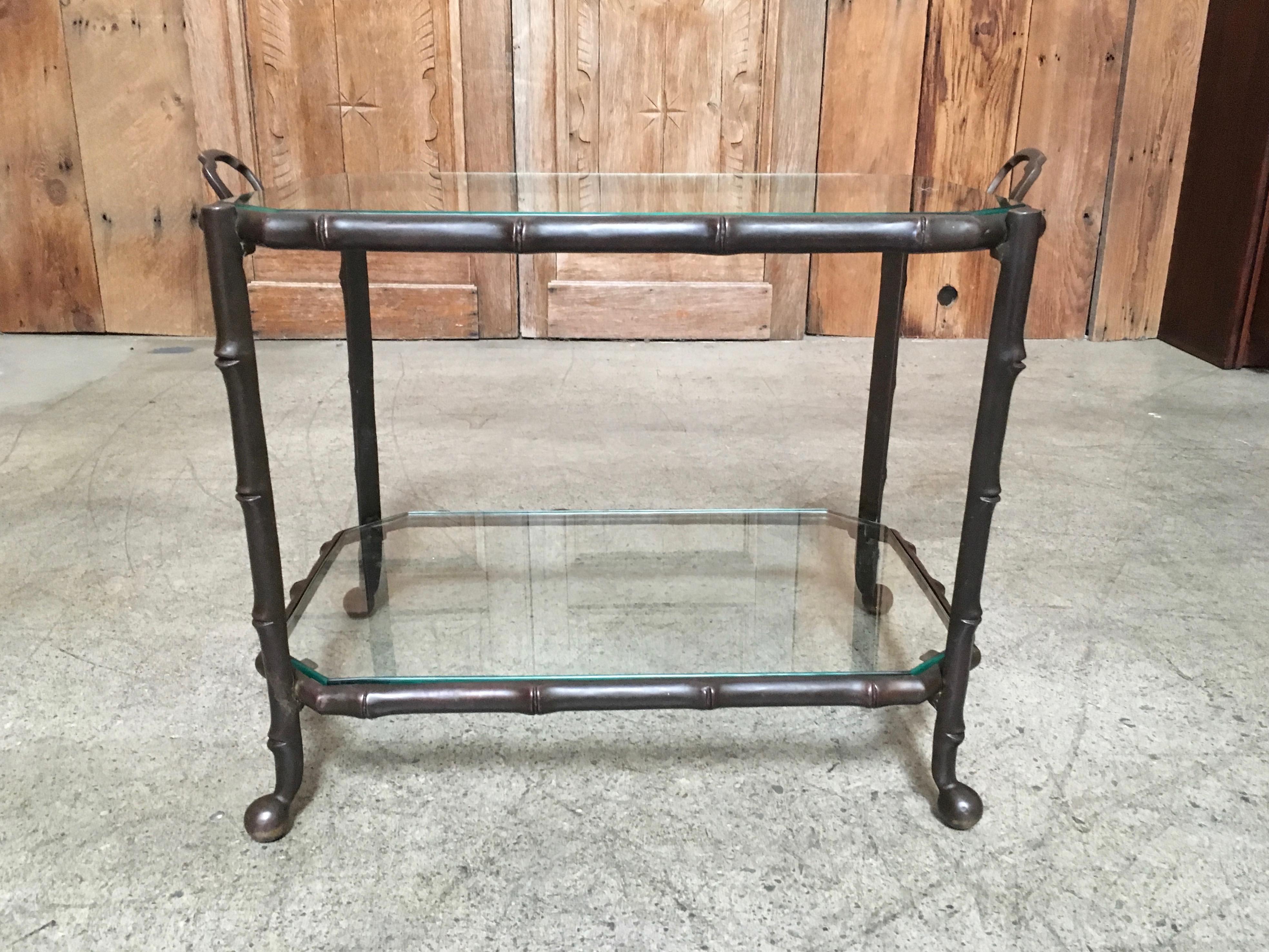 Very heavy solid bronze side table in a faux bamboo style with glass top glass height is 19.5.