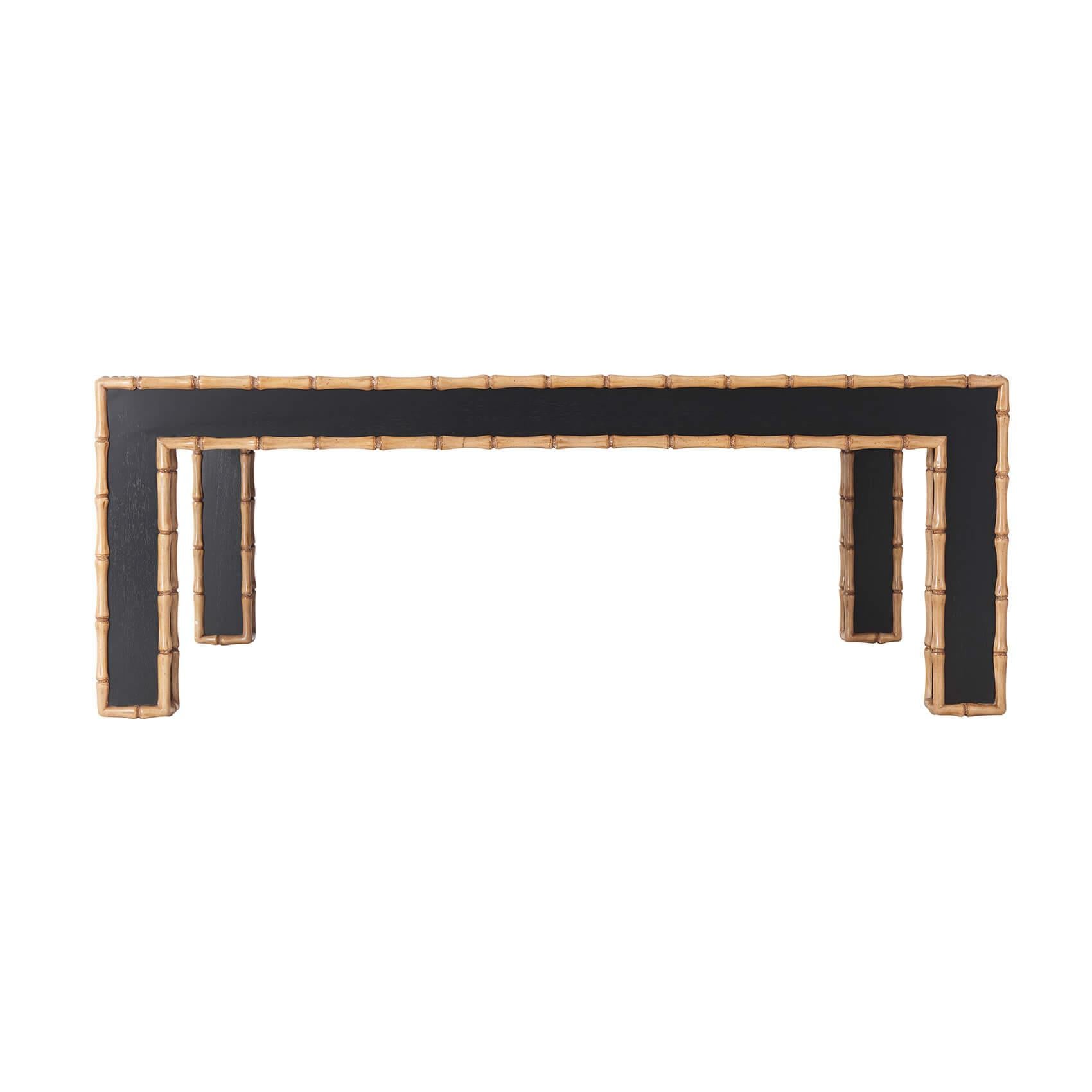 19th century style square cocktail table with a carved faux bamboo edge to the entire frame, a brushed and textured veneered top, and four bold corner supports.

Dimensions: 48