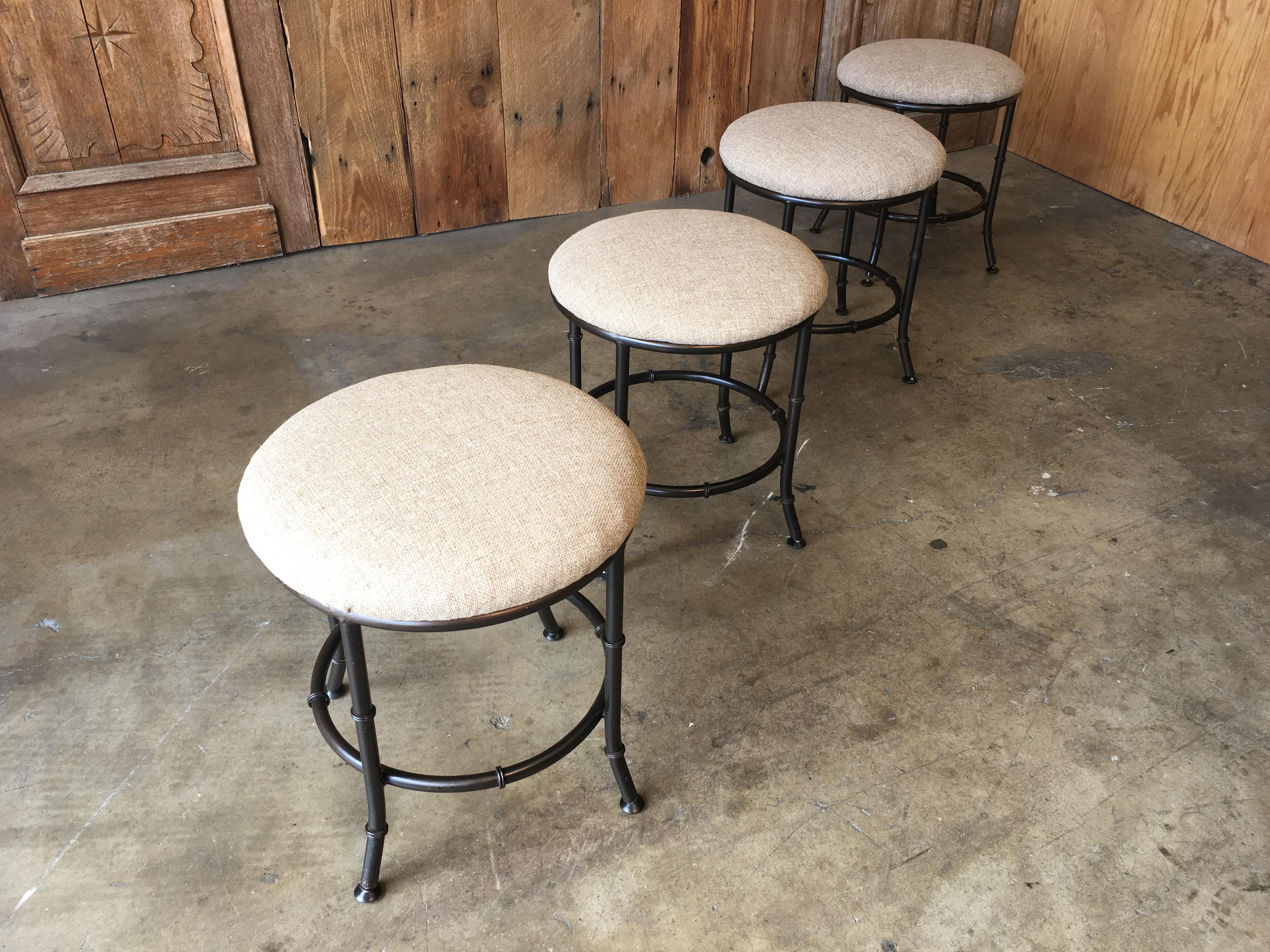 Faux bamboo stools in a bronze finish.