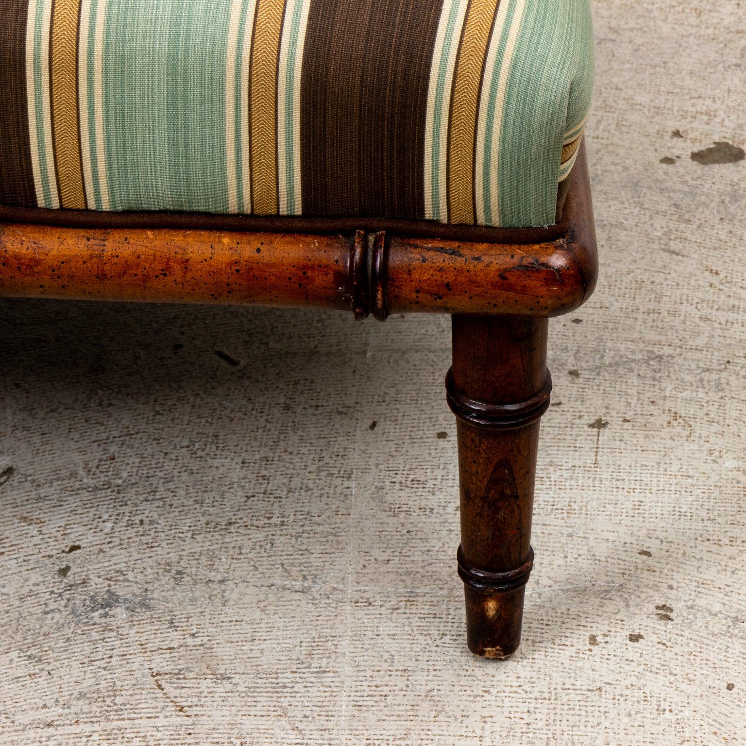 Faux Bamboo armchair upholstered in a striped linen fabric. Made in USA. Please note wear consistent with age.
  