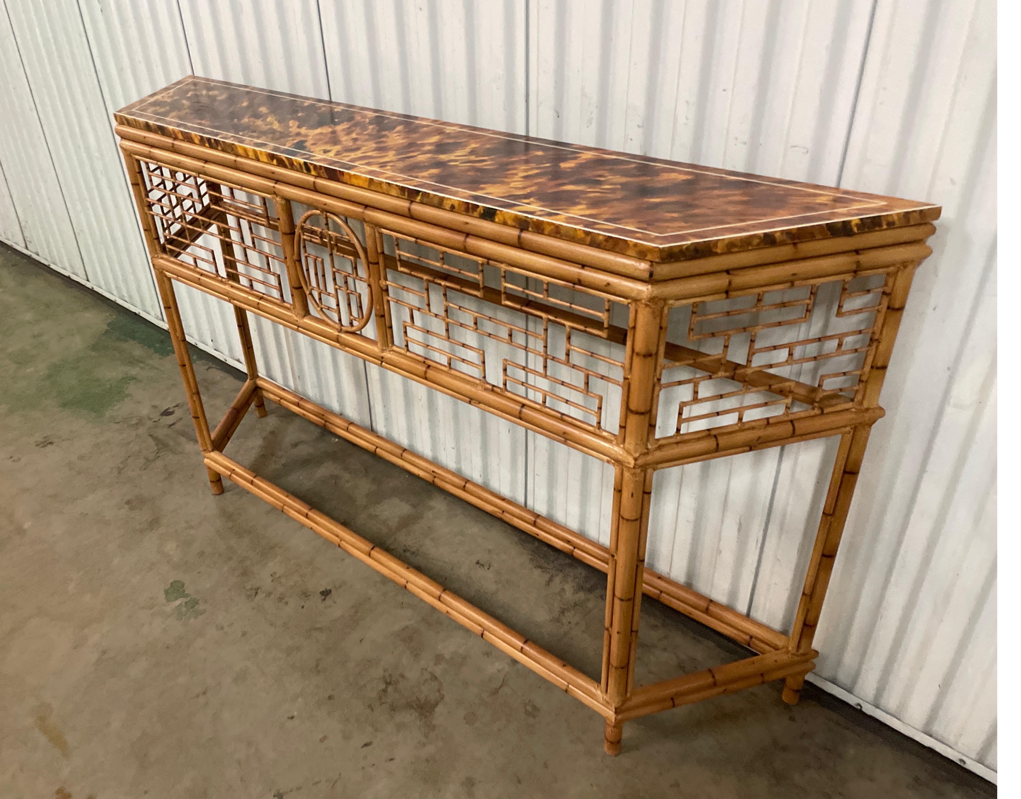 Tole faux bamboo Chinoiserie console with faux painted wood tortoise top. Two are available to those wishing a pair.