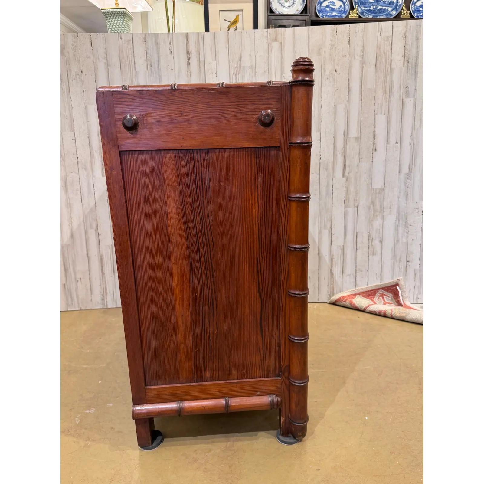 This is a beautiful faux bamboo vanity chest of drawers! Of French make, this piece has all the typical charm of that style. Lovely glow and patina in the wood, and the hand carved diamond detailing on the drawers and the carved bamboo