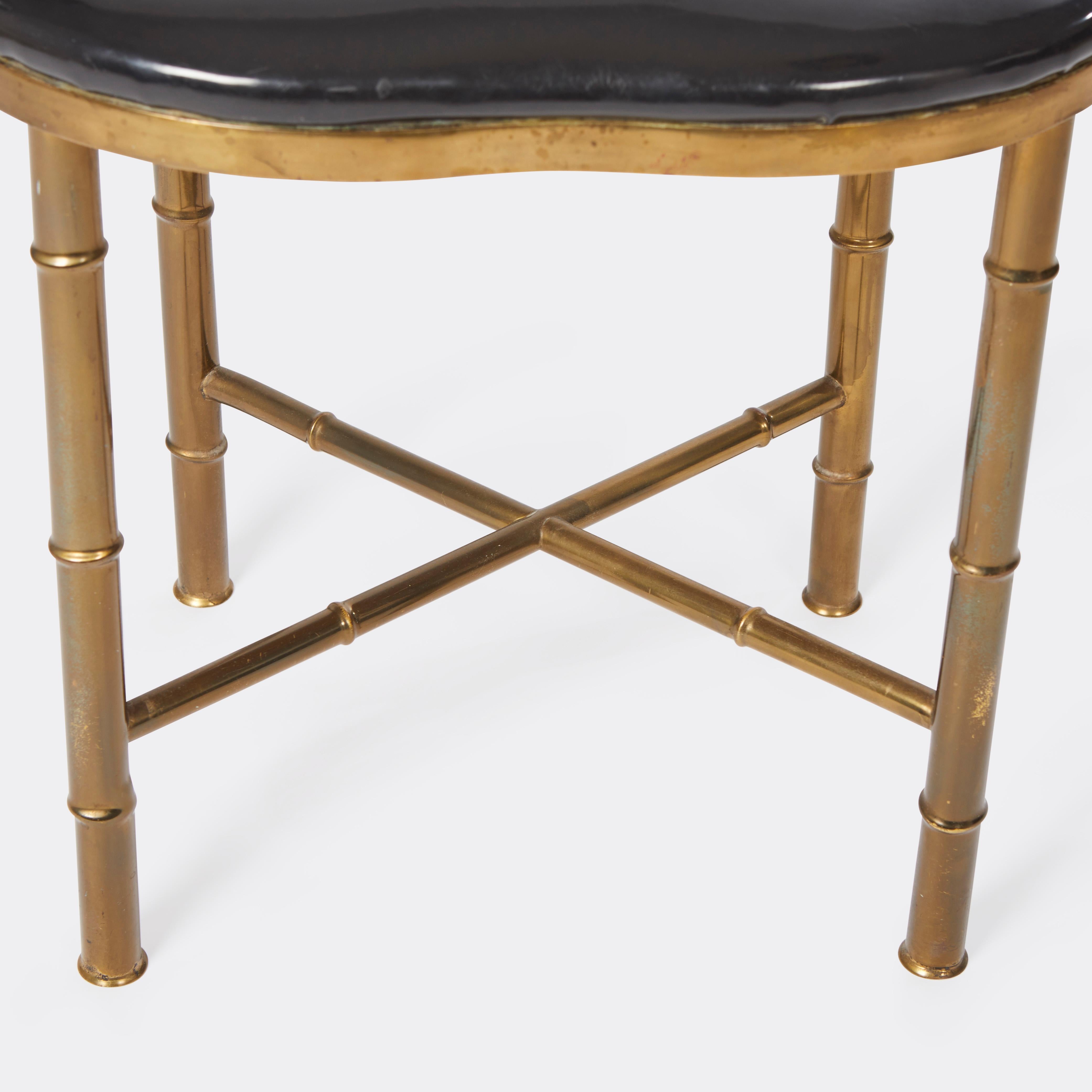 A mid century brass faux bamboo vanity stool. Circa 1960.