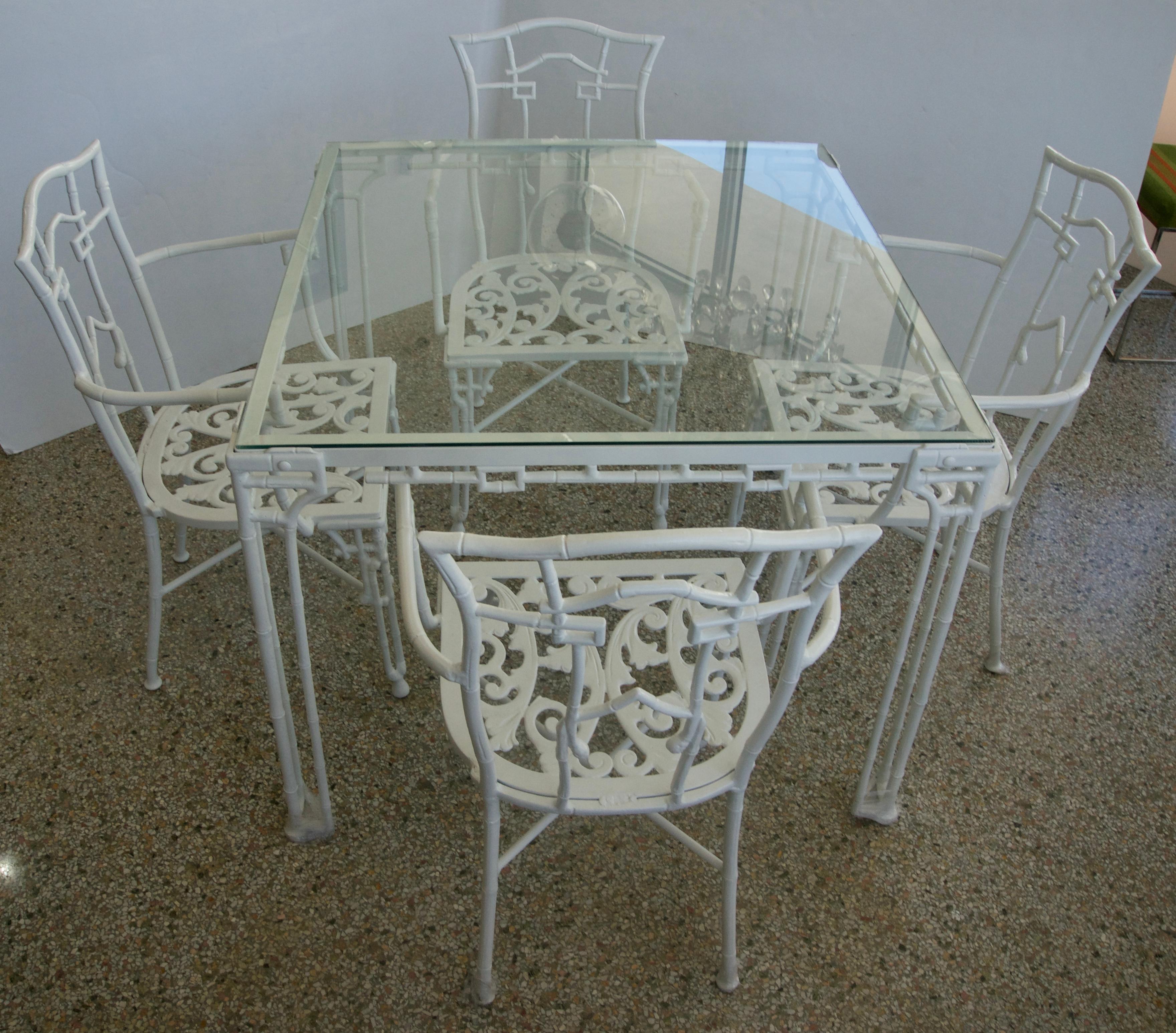 This stylish five-piece patio set was recently acquired from a Palm Beach estate and has been professionally restored and powder coated in 