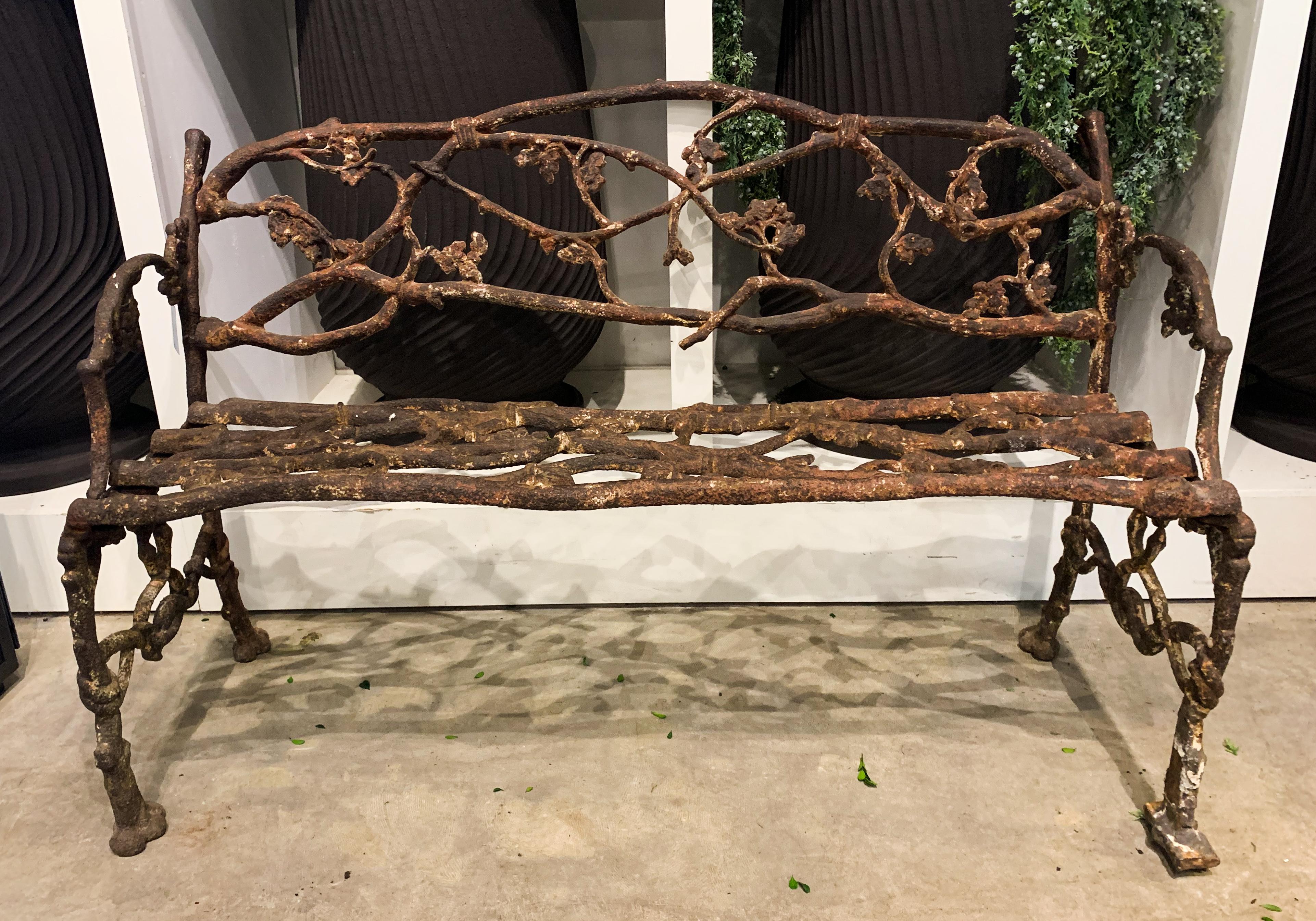 A charming garden accent, this cast iron faux Bois bench has been radically weathered to perfection. A testament to Janes, Beebe & Co foundry, one of the most important cast-iron foundries in pre-civil War America, timeless designs.  Featuring tied