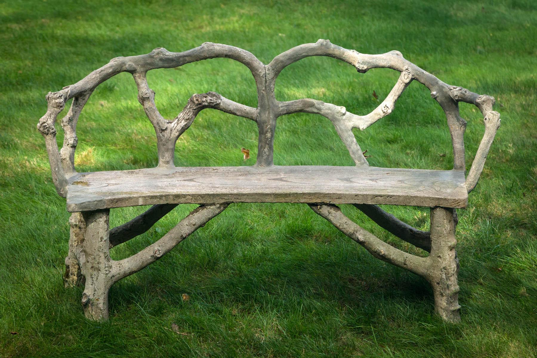 Faux bois bench with naturalistic design.