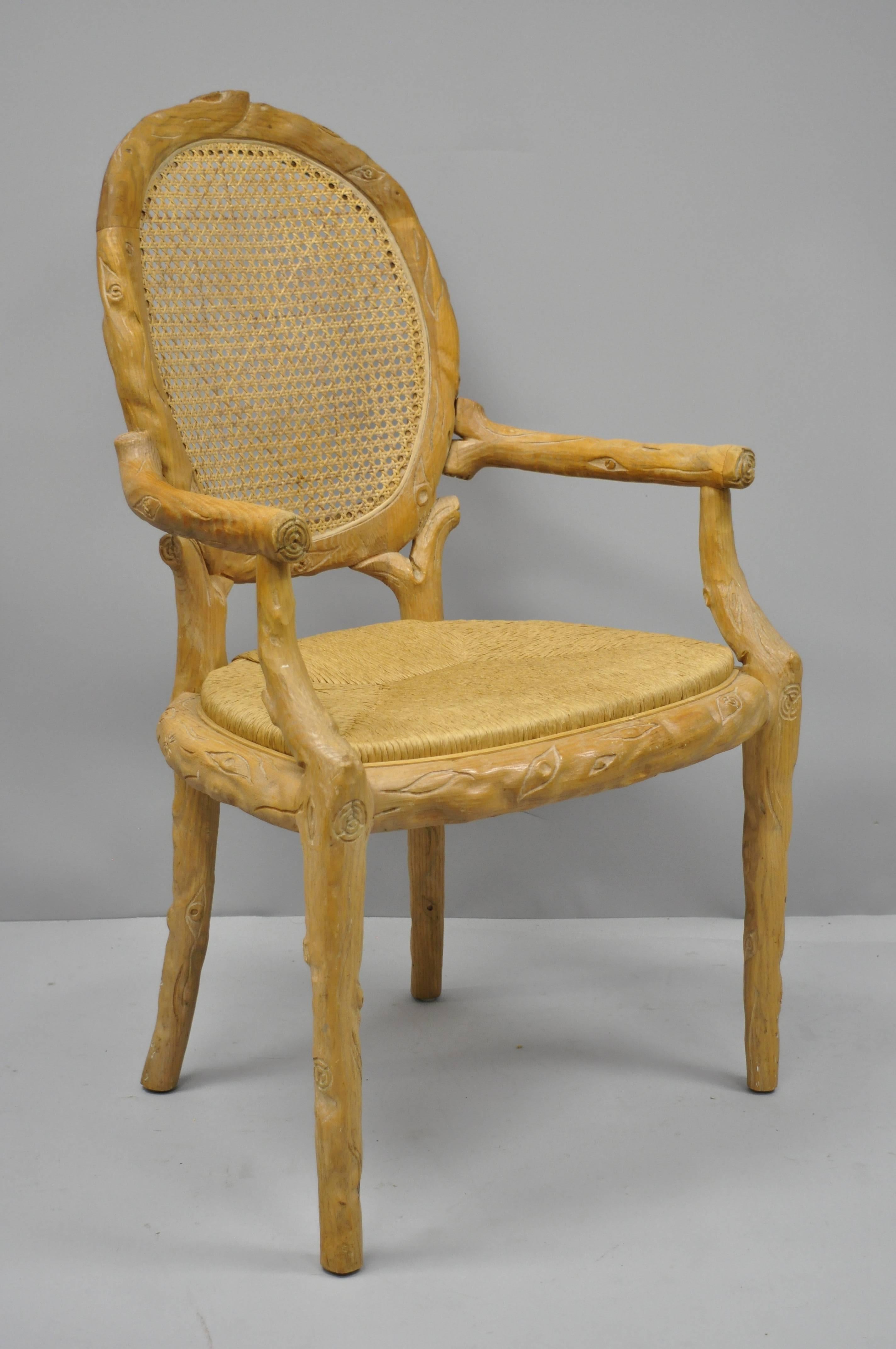 A pair of vintage faux bois rush seat dining chairs. Item features heavy solid wood construction, nicely carved details, tapered legs, oval cane backs, woven rush seats, quality American craftsmanship, circa mid-late 20th century. Measurements: 39
