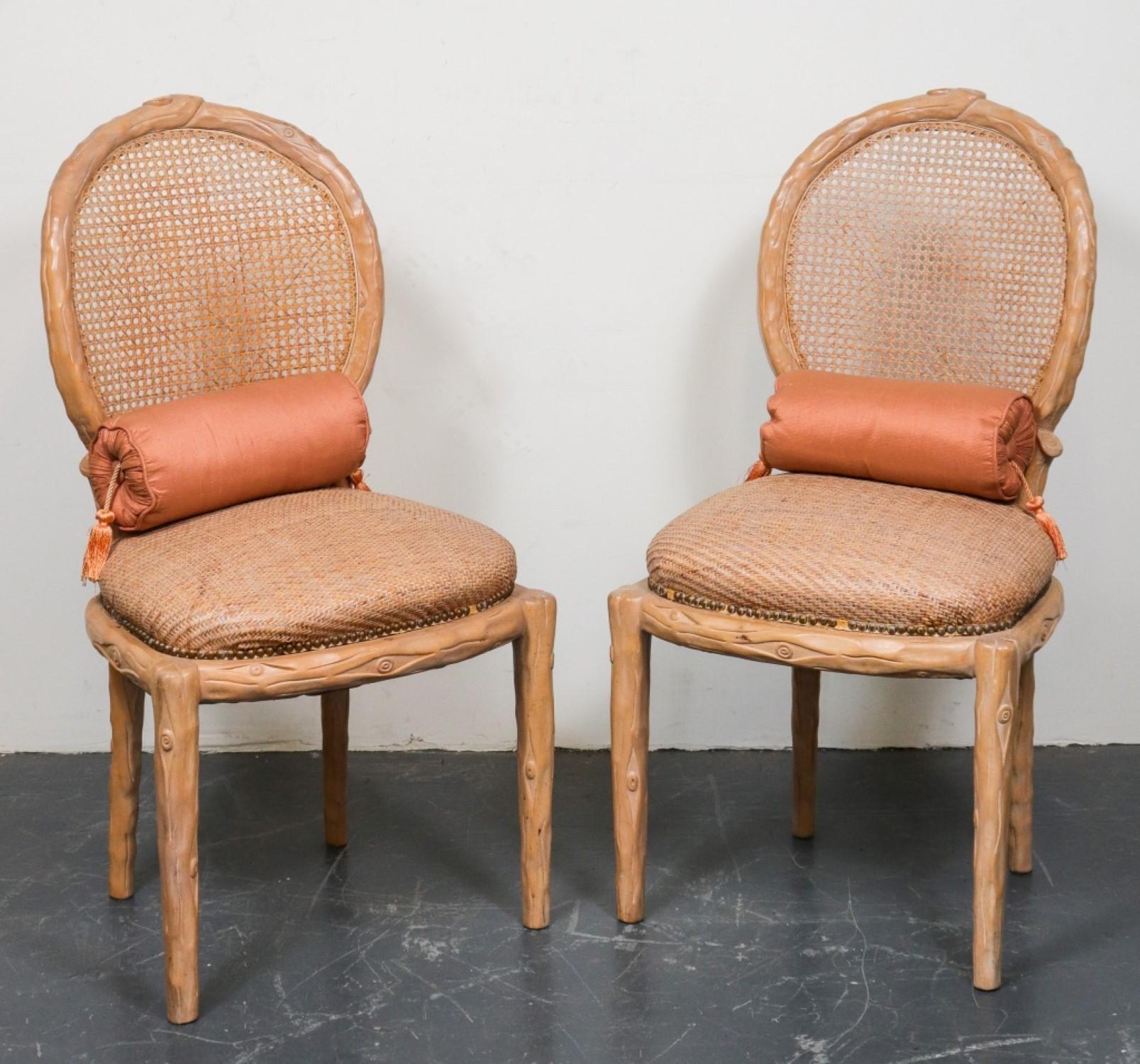 Pair of Faux Bois Side Chairs

Features: Caned backs, brass-studded wicker cushion seats, accompanied by silk upholstered bolster pillows.

Dealer: S138XX
