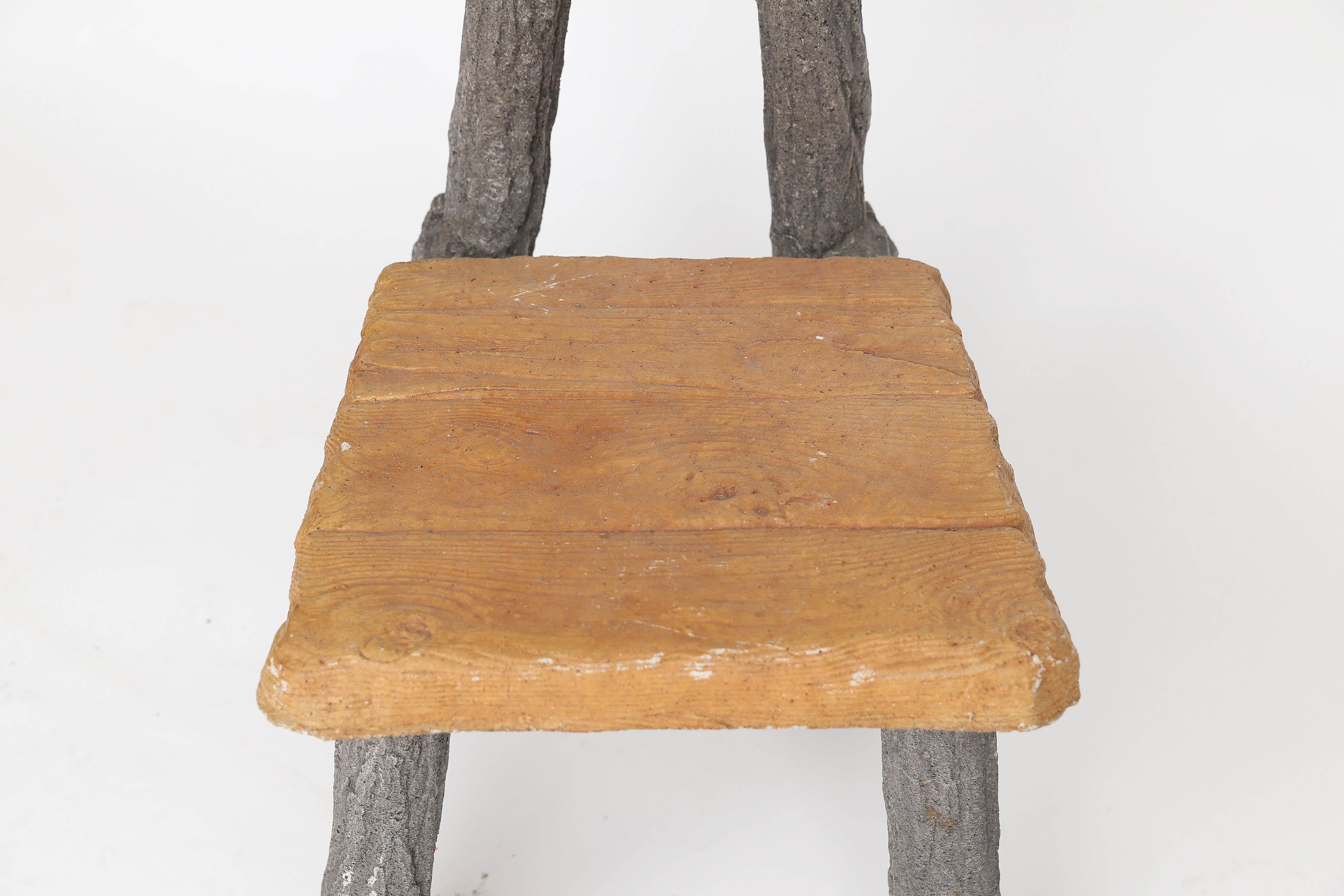 Made of concrete, an outstanding single faux bois chair found in France. This sturdy faux bois chair would be great indoors or outside in your garden. A fun and interesting conversation piece.