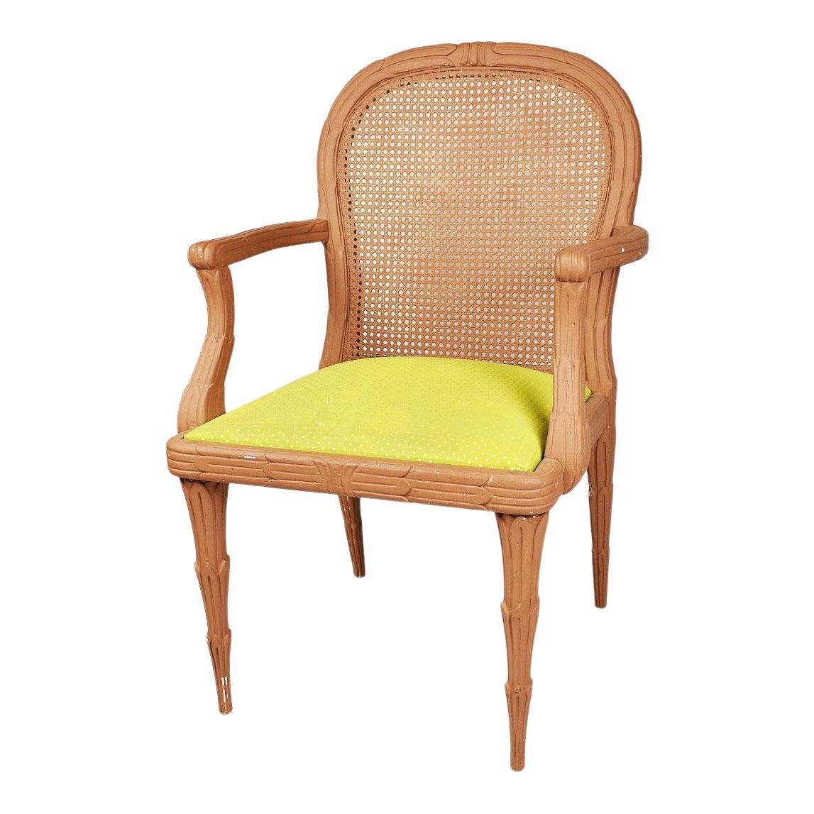 A beautiful wood faux bois armchair with cane back and bright green upholstered seat. A Hollywood Regency staple, faux bois furniture is a highly sought after finish among decorators and furniture aficionados. It’s a design that has stood the test