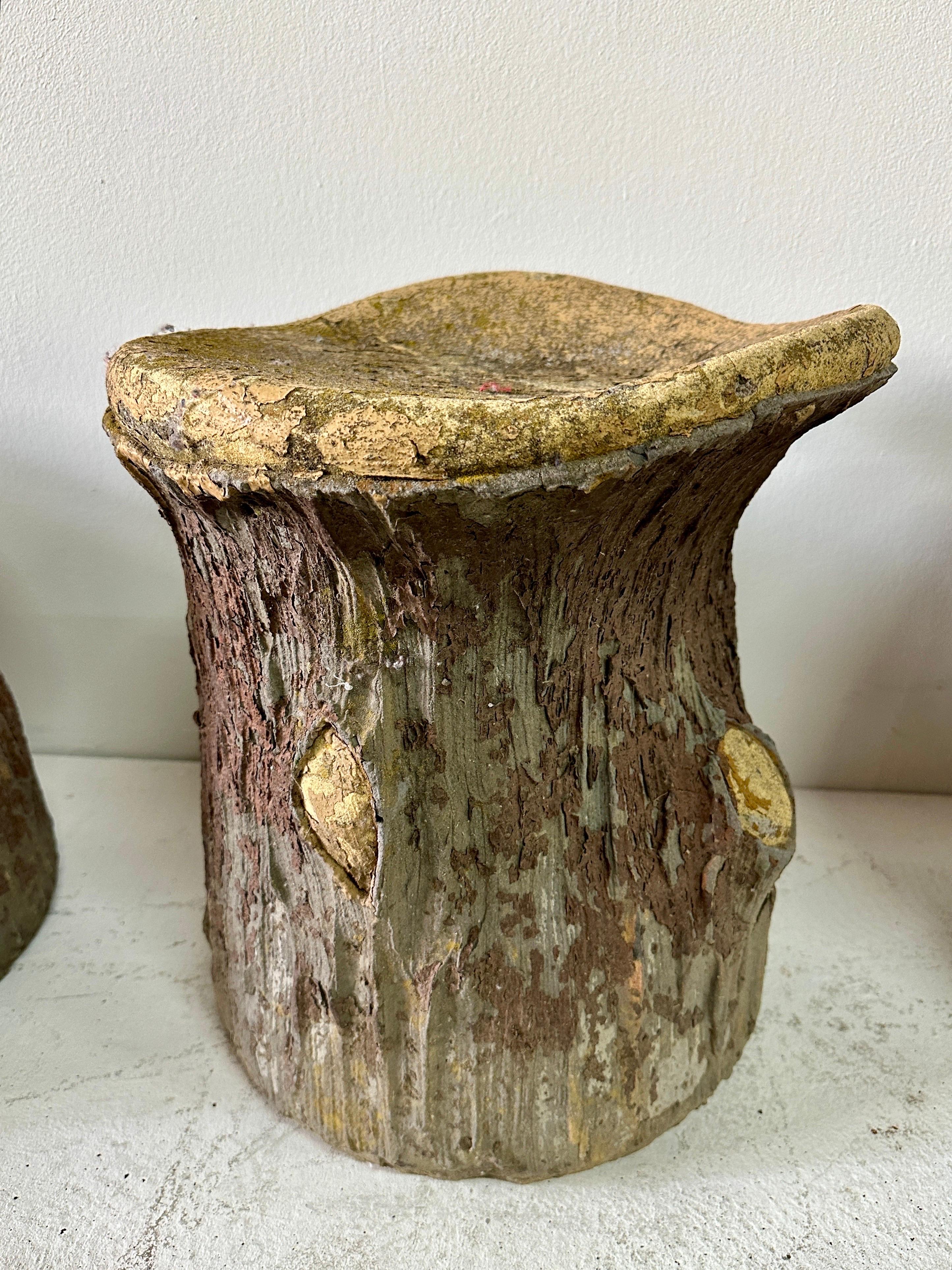 We have SEVEN (7) of these beauties available.  ALL original colors and finish providing the illusion of wood trunks and aged peeling bark exterior.  These substantial mid-century concrete faux-bois stools with so many design details. Each stool is