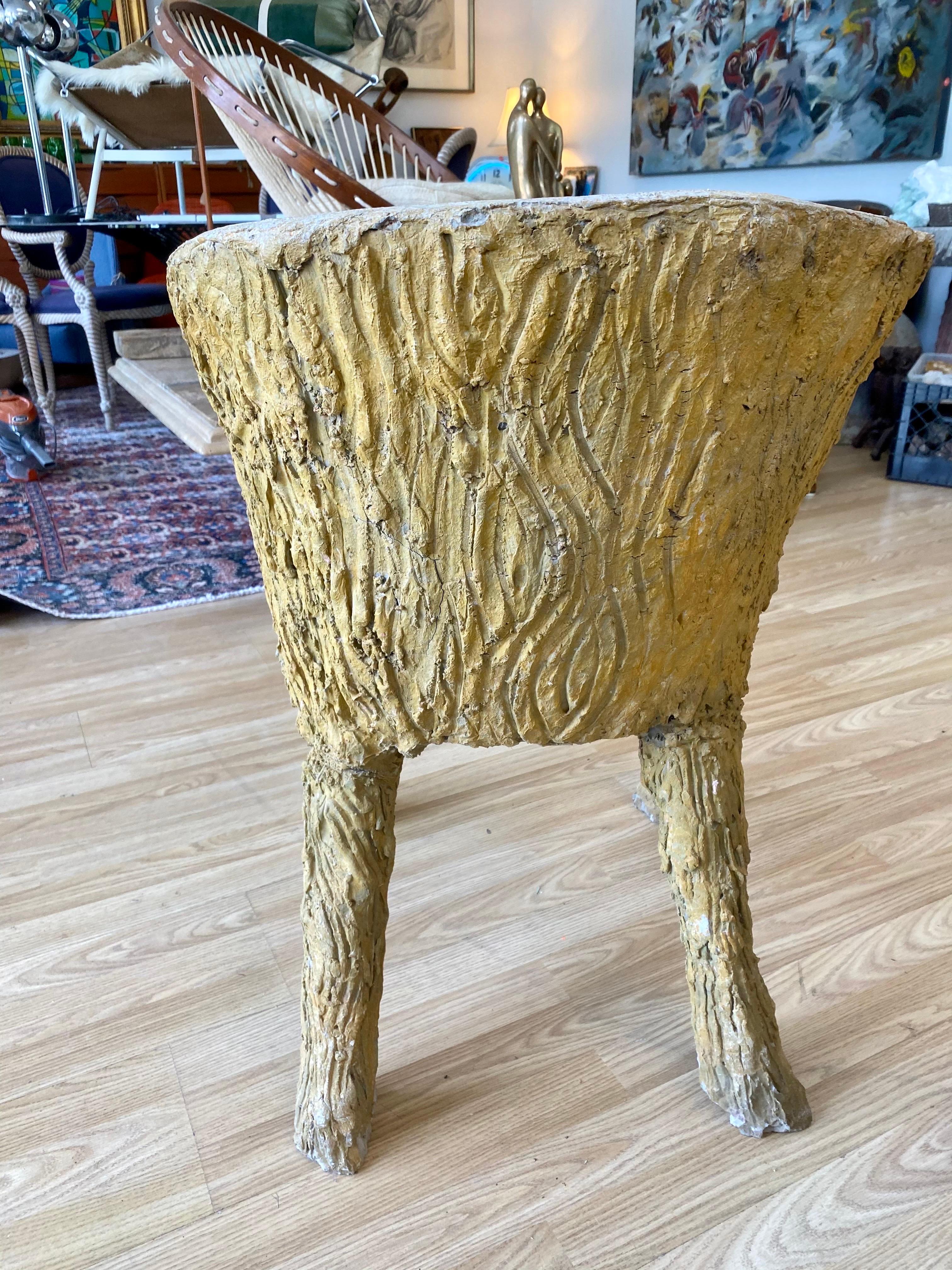 Beautiful faux bois chair. Made of concrete, faux bois refers to the artistic imitation of wood and wood grain.
