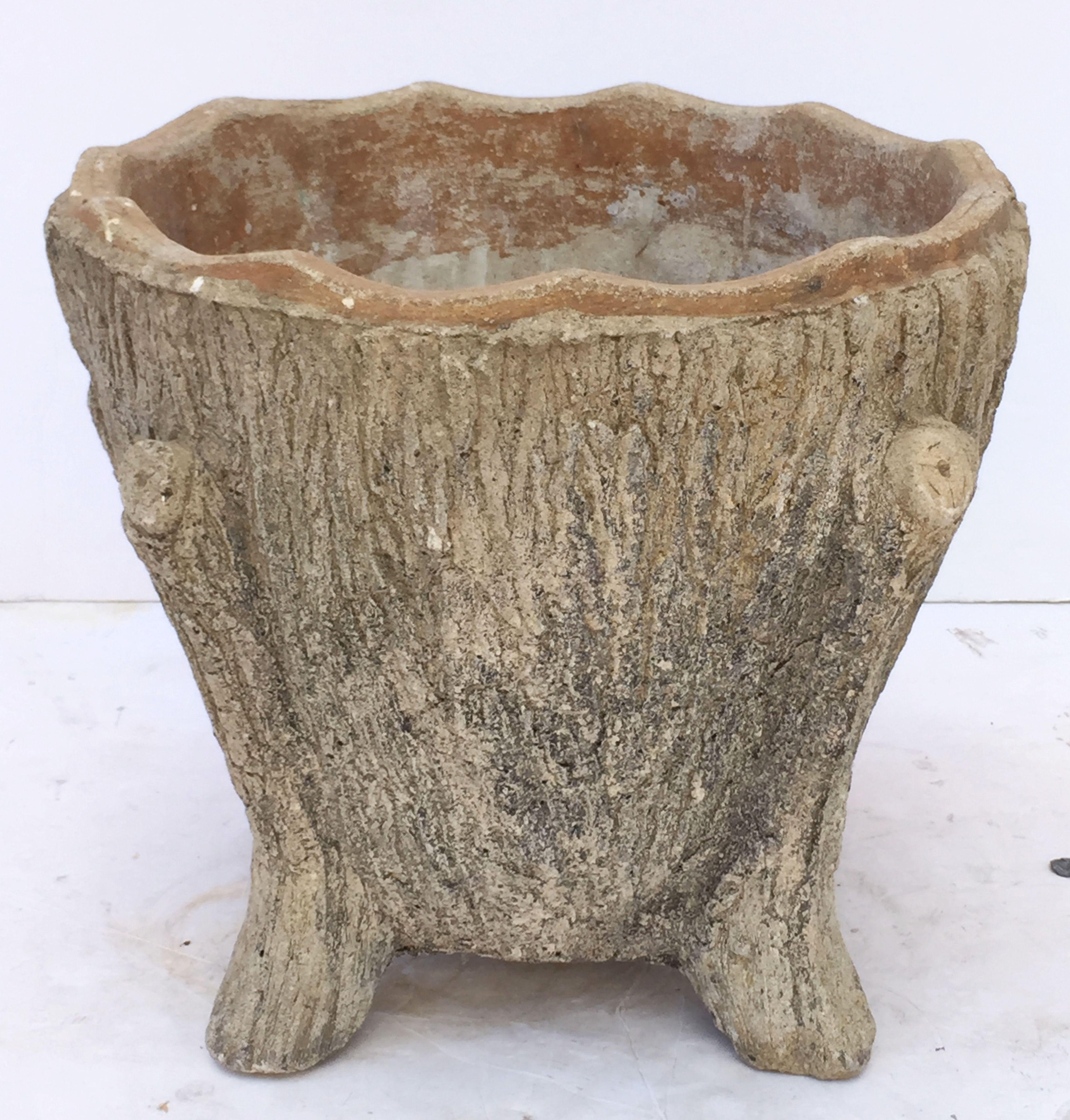 A Fine large English garden planter of composition stone standing on four legs, with a serpentine rim. Featuring a faux bois (tree trunk-like) design around the circumference - a lovely feature for the garden or patio.

Perfect for an indoor or