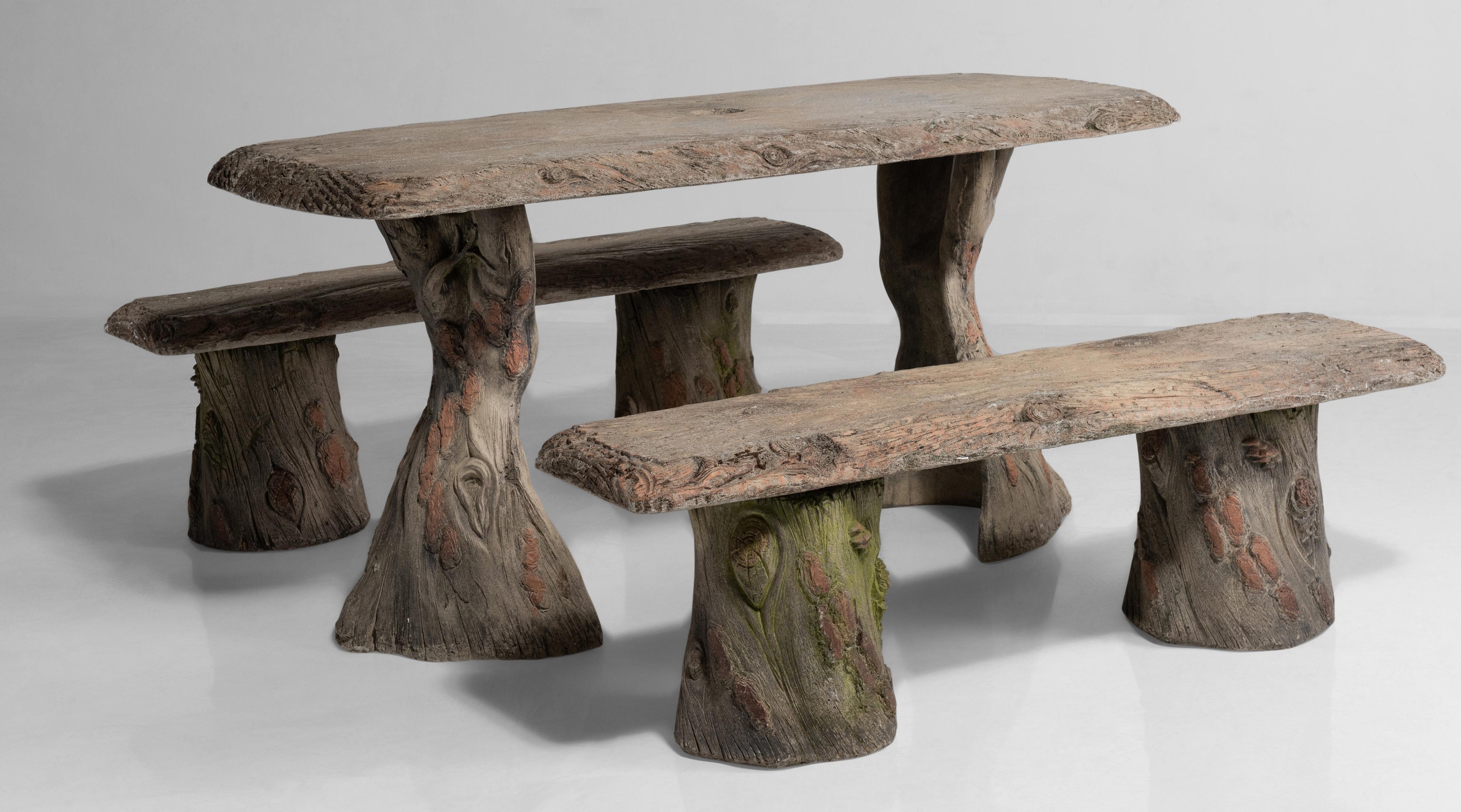 Faux Bois garden table with benches, France, 20th century.

Cast concrete with detailed carving and weathered paint. Umbrella stand included.

Measures: Table: 59.5” W x 29.25” D x 29” H, bench: 53.5” W x 14.75” D x 16.5” H.