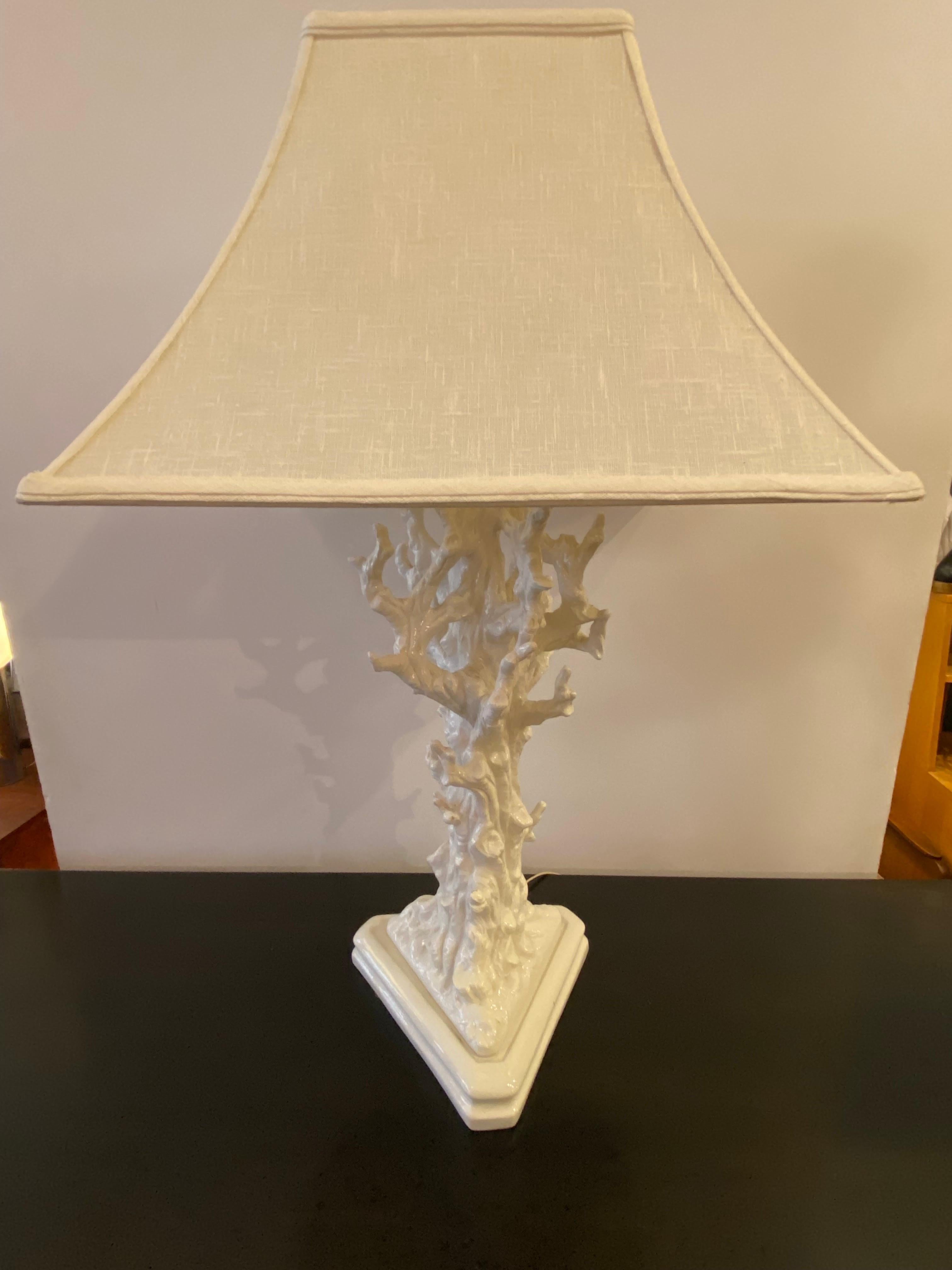 Italian Faux Bois ceramic tree branch table lamp. Triangular base supports the lamp. In very nice shape with just a couple nicks to glaze, no signs of repairs to branches! 3 way switch gives plenty of light! White glaze, lampshade included if
