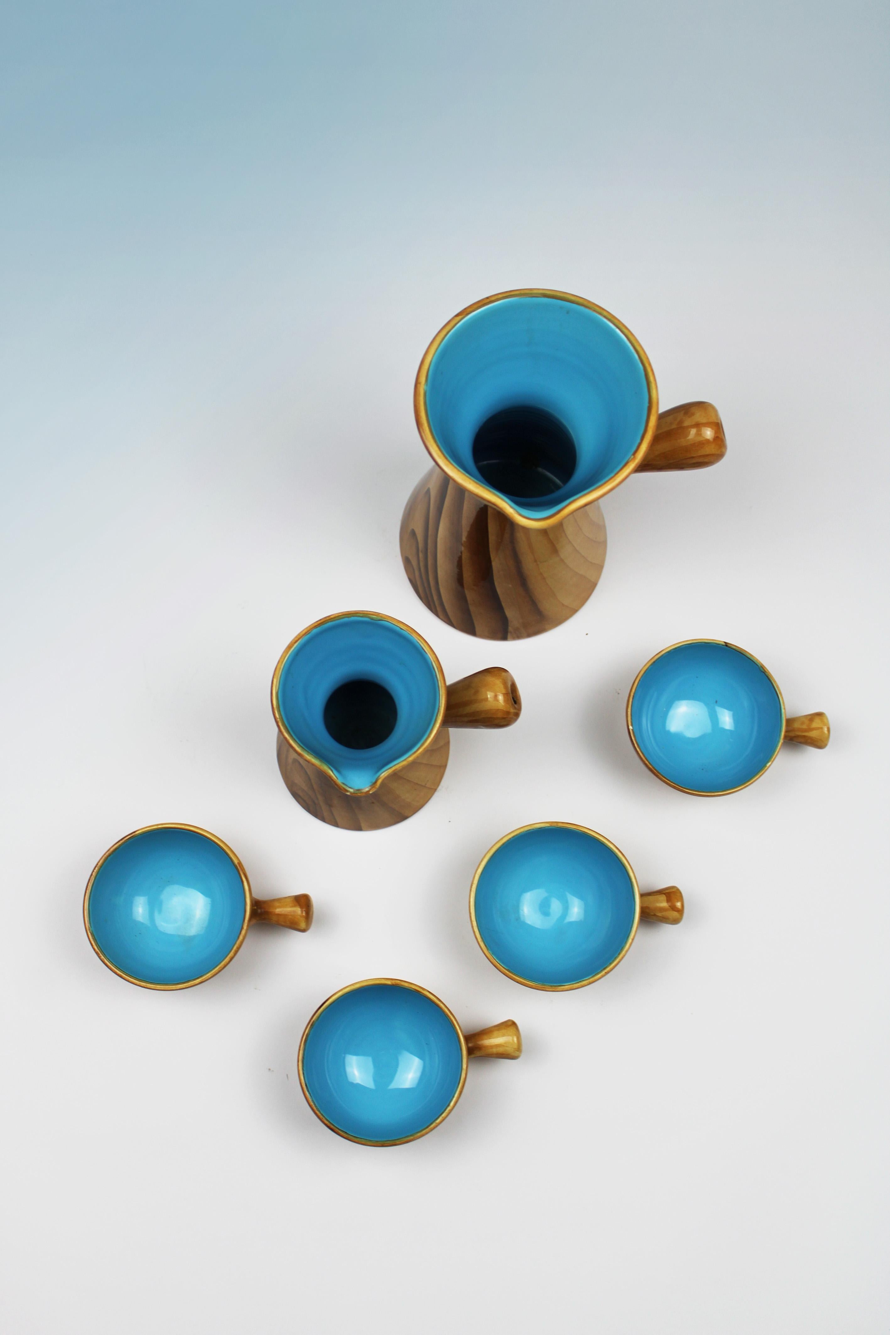 Introducing the timeless elegance of the Faux Bois Mug & Cups, designed by the visionary Grandjean Jourdan and meticulously crafted by Vallauris Ceramics in France during the 1960s. These exquisite pieces showcase the epitome of mid-century design,