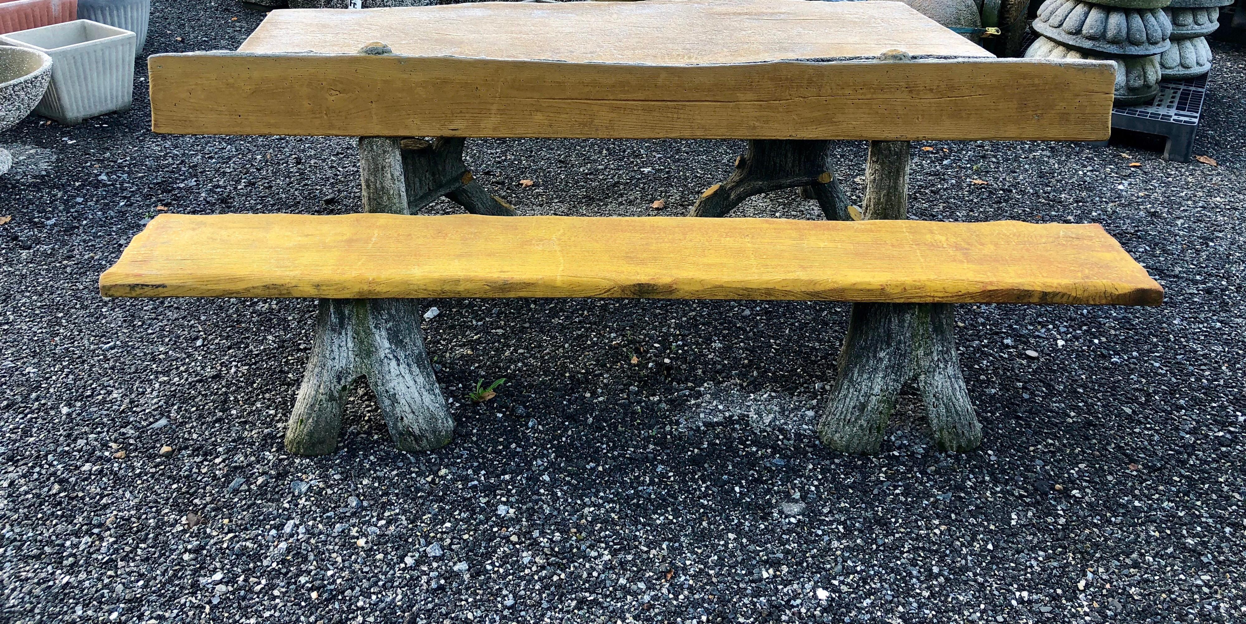 Garden bench made of molded and painted concrete that look like a tree. Made in France in the 20-th century. 

There is also a table available.
For the table and the bench the price is special: Euro 7000
The bench is yellow painted, wide