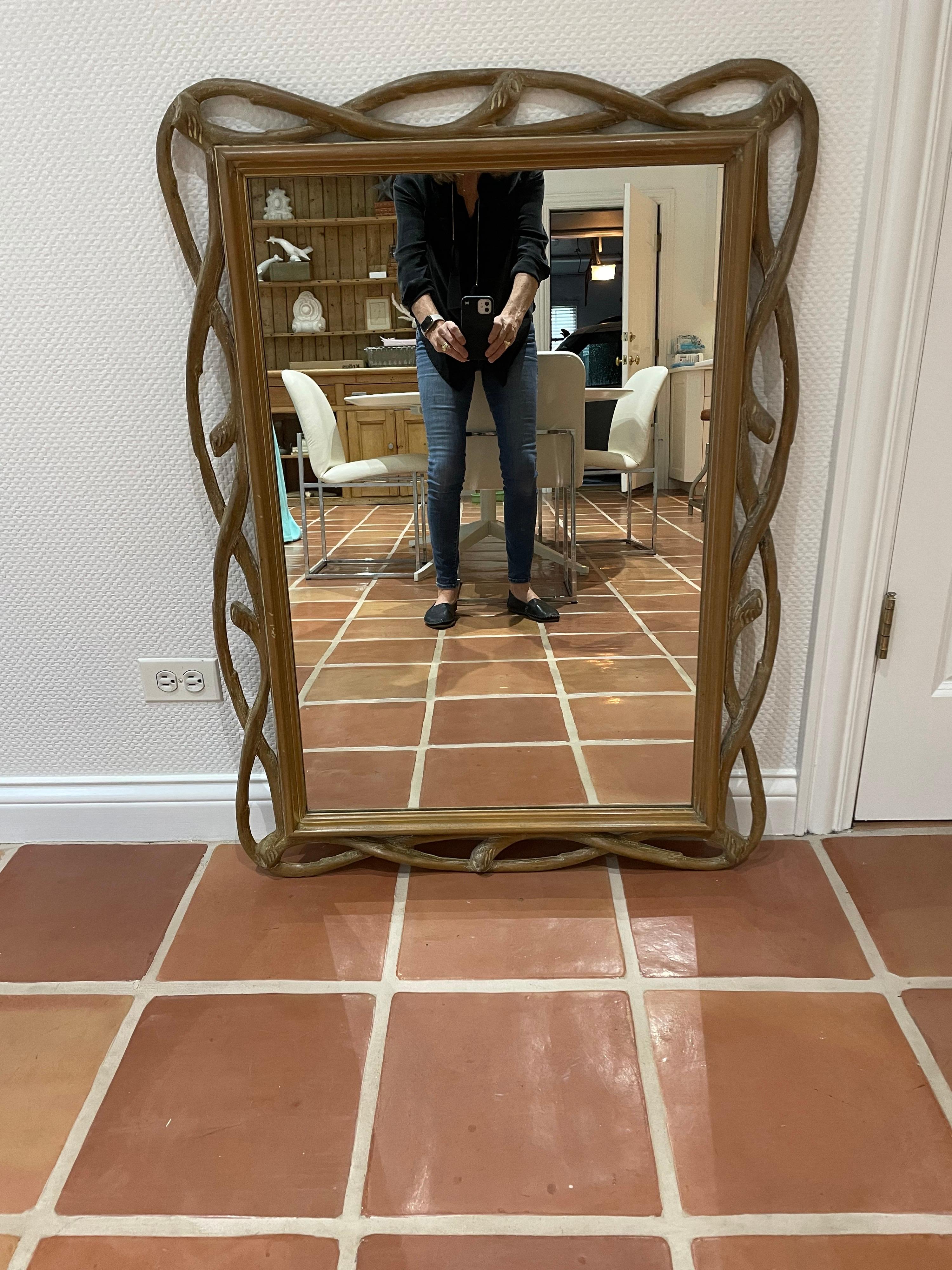 This is a 1970s wood faux bois mirror in great condition.