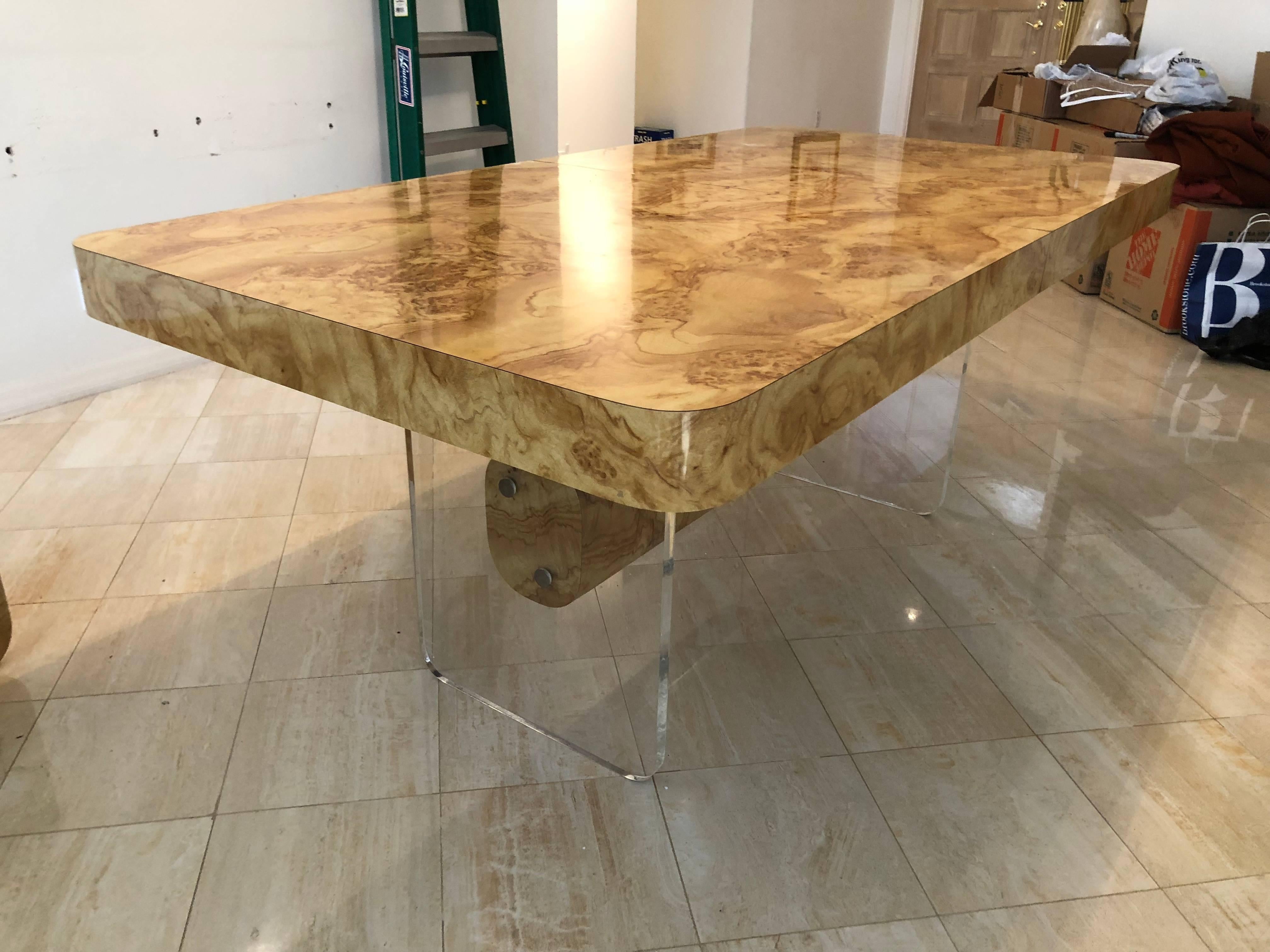 Faux burl wood and Lucite dining table with two extension leaves. Some scuffs on the laminate. Top and bottom are attached but i wanted to picture the base as well to be better viewed. Matching wall.

There are two leaves which each measure 16