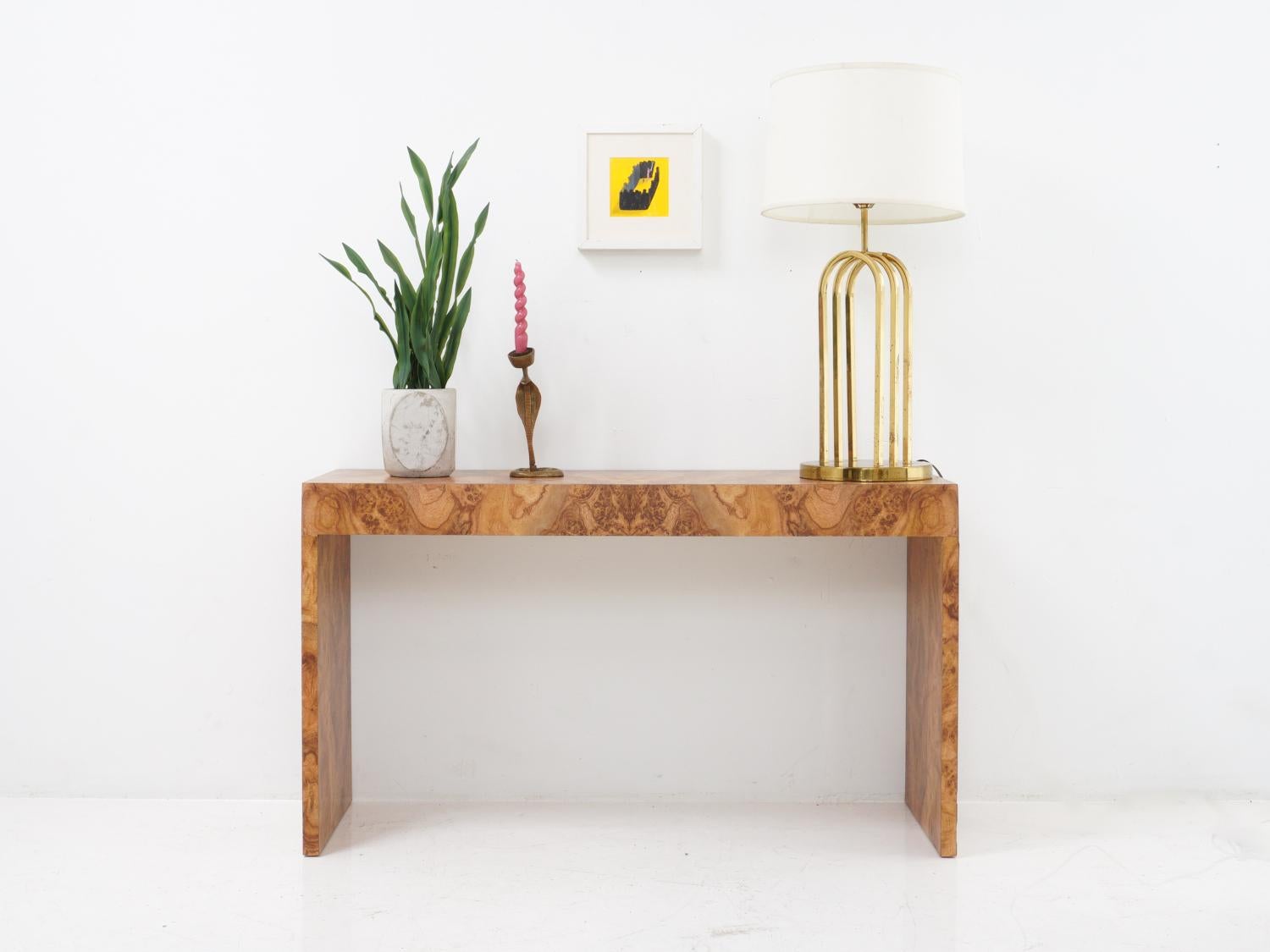 Who says you need real wood to make a statement? This faux burl wood console begs to differ!

- 27.25