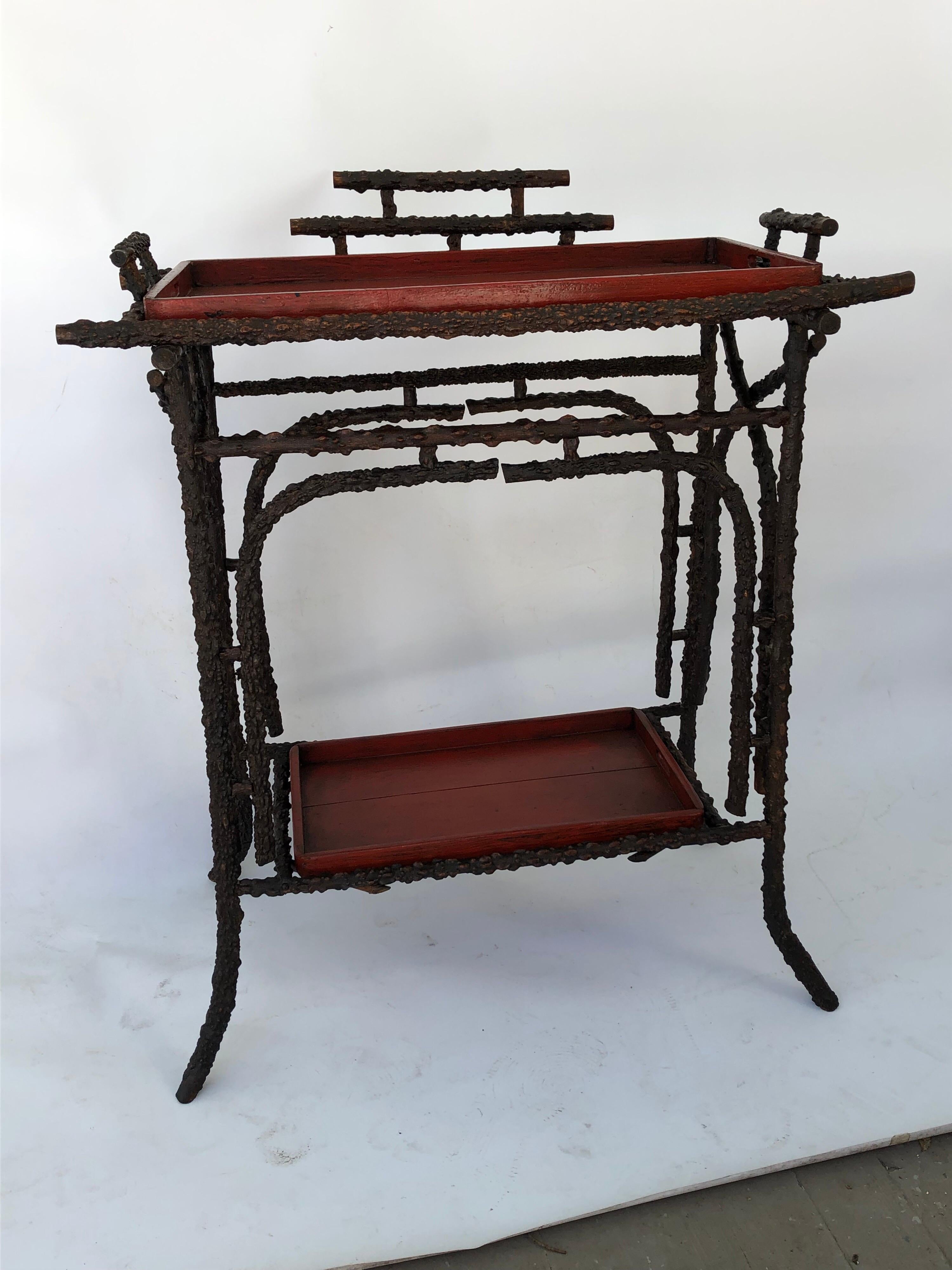 Faux Burr root wood stand with two Nagara Nuri style red with black undertone lacquer trays. Oriental style stand. Makes a lovely bar. There is a crack in the top
tray but doesn't effect the strength of the piece.