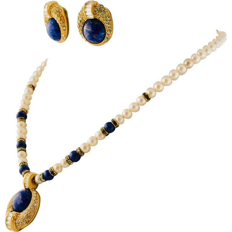 This faux Christian Dior lapis pearl diamond and gold necklace with matching round pendant and pierced earrings is a mid-century collectors item. The name of this unique and rare jewelry set is”Revelie”. Although “faux” the patented design is true