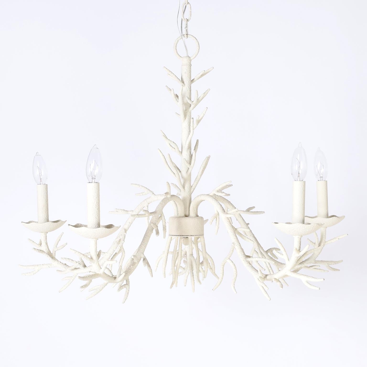 Mid century five light faux coral iron chandelier with a textured white paint finish over a sea inspired form.