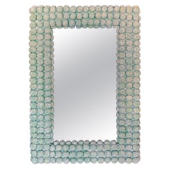 Specchio in finto corallo in Greene & Greene