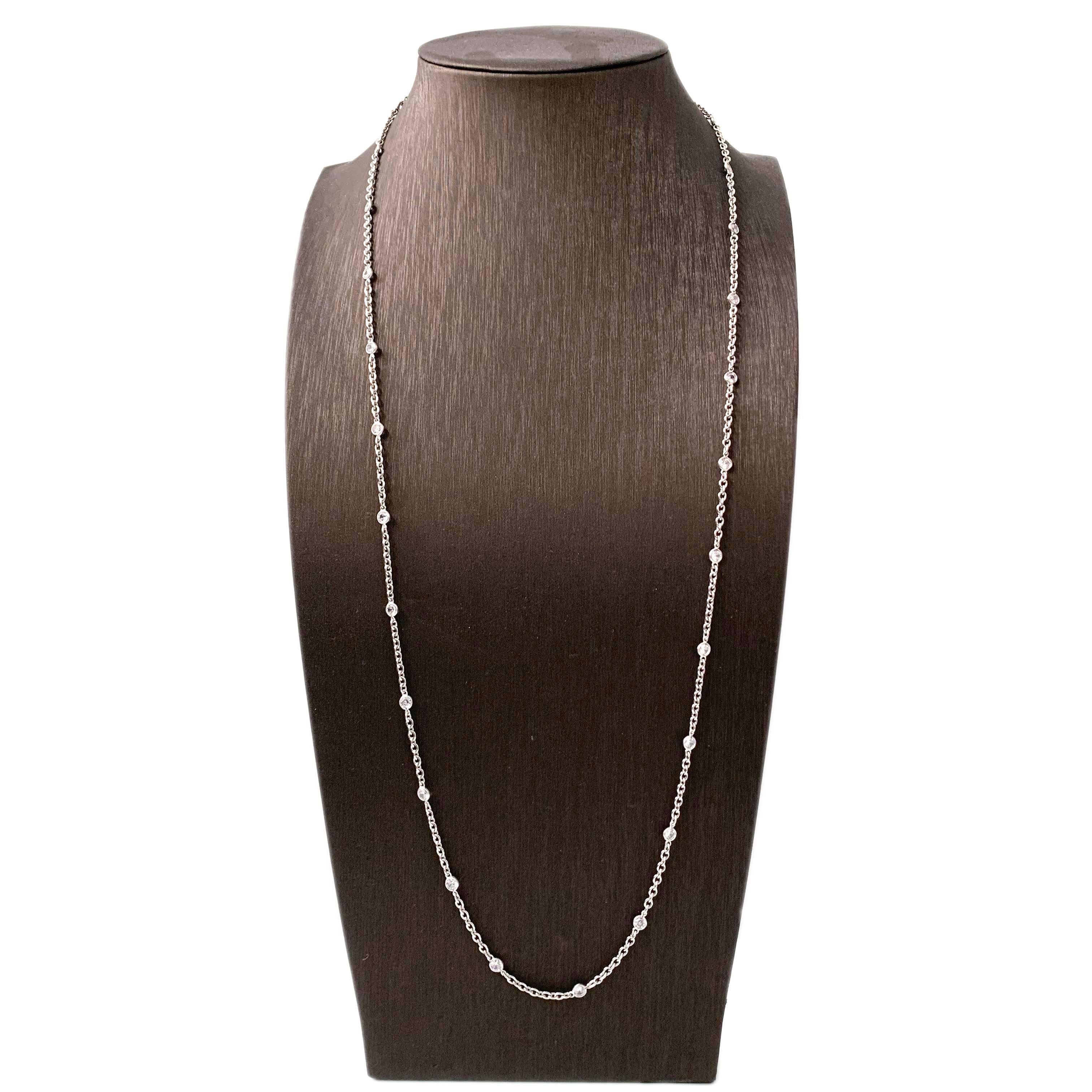 Simulated Diamond by the Yard Sterling Silver Long Necklace

A long and elegant platinum tone chain is embellished with hand bezel-set faceted simulated diamond cz (0.25ct size each - 6.25ct size total) every 1