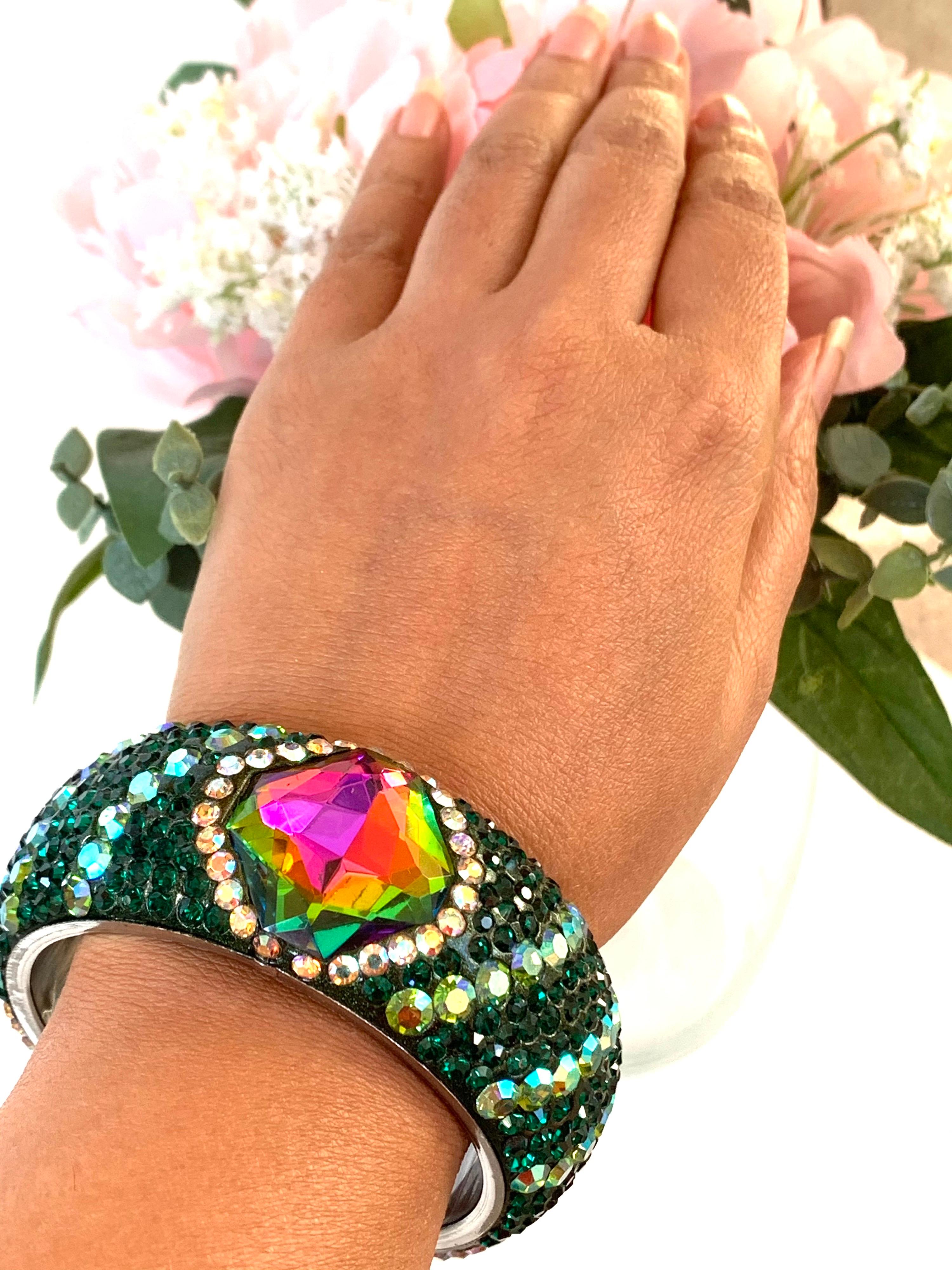 Stunning Slip On bracelet embellished with bright color emerald green and multi color rhinestones.  Only 1 available.
Inner diameter 65.00 mm (2.56 in), inner circumference 204.2 mm (7.04 in)

FOLLOW  MEGHNA JEWELS storefront to view the latest