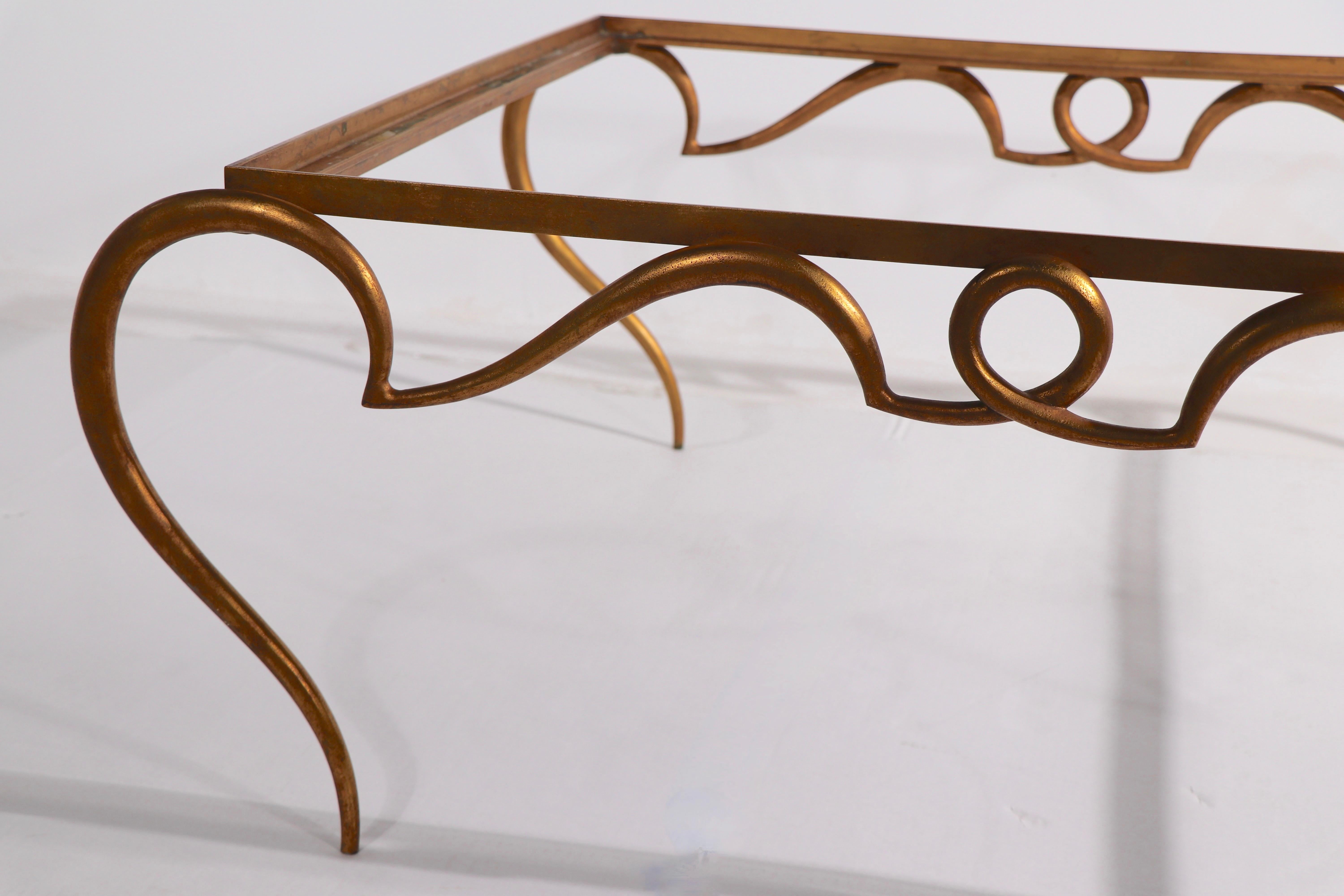 Faux Gilt Metal Scrollwork and Glass Coffee Table att. to Rene Drouet In Good Condition For Sale In New York, NY