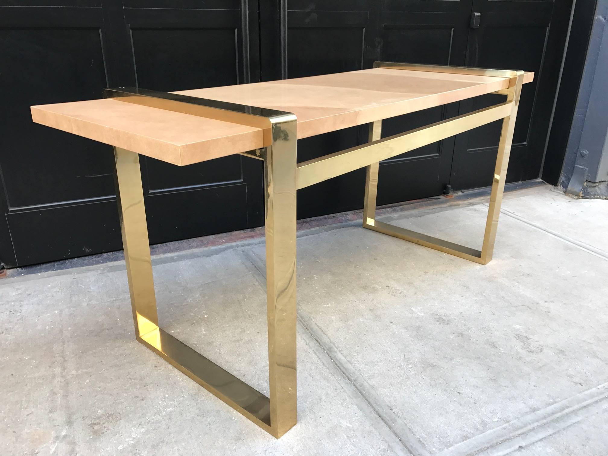 Faux goatskin and brass console table.