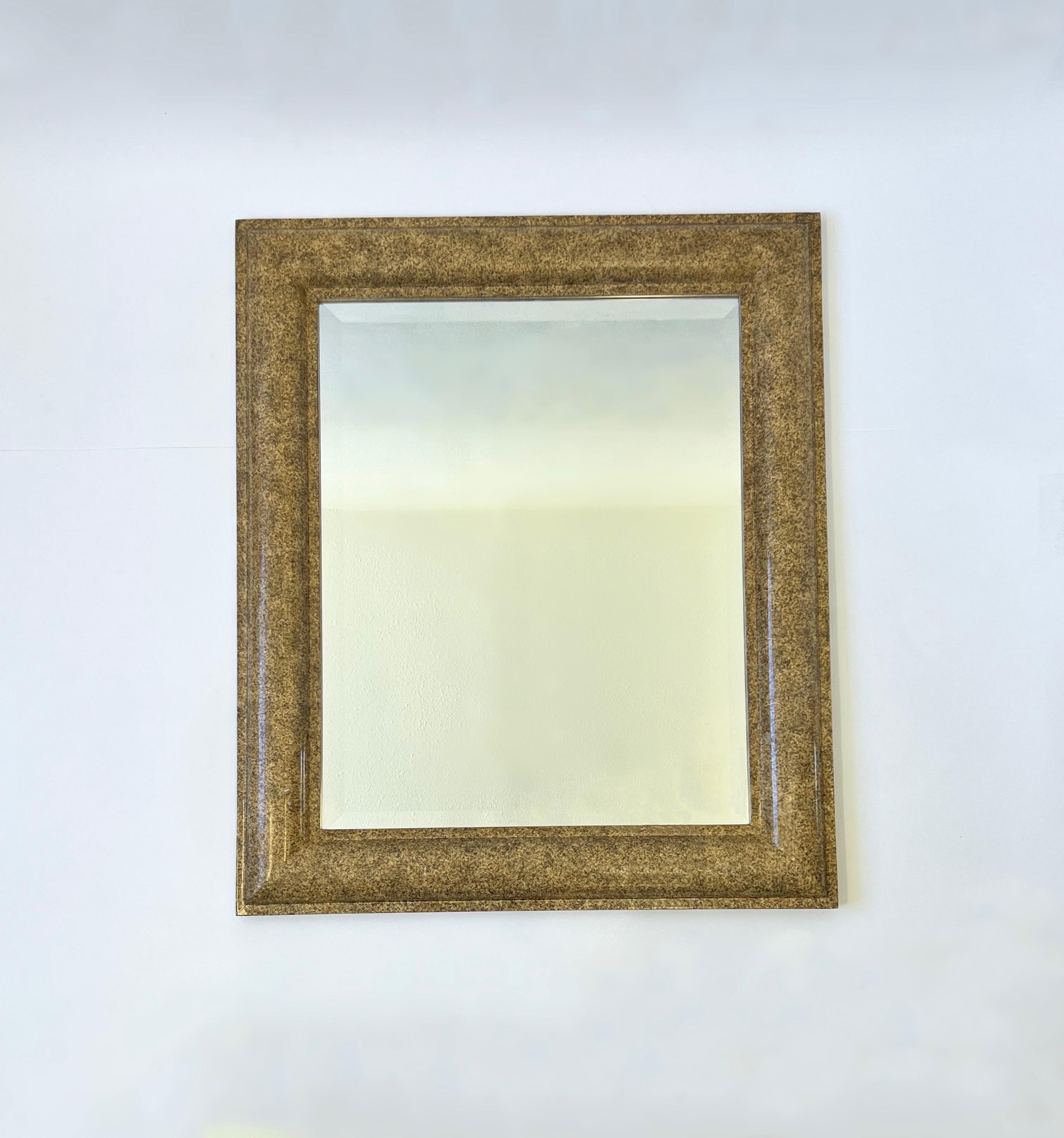  1980’s large beveled wall mirror in the manner of Karl Springer by J. Robert Scott. 
The frame is constructed of wood with a faux granite lacquer finish. 
In original vintage condition with minor wear consistent with age. 
Measurements; 39” Wide,
