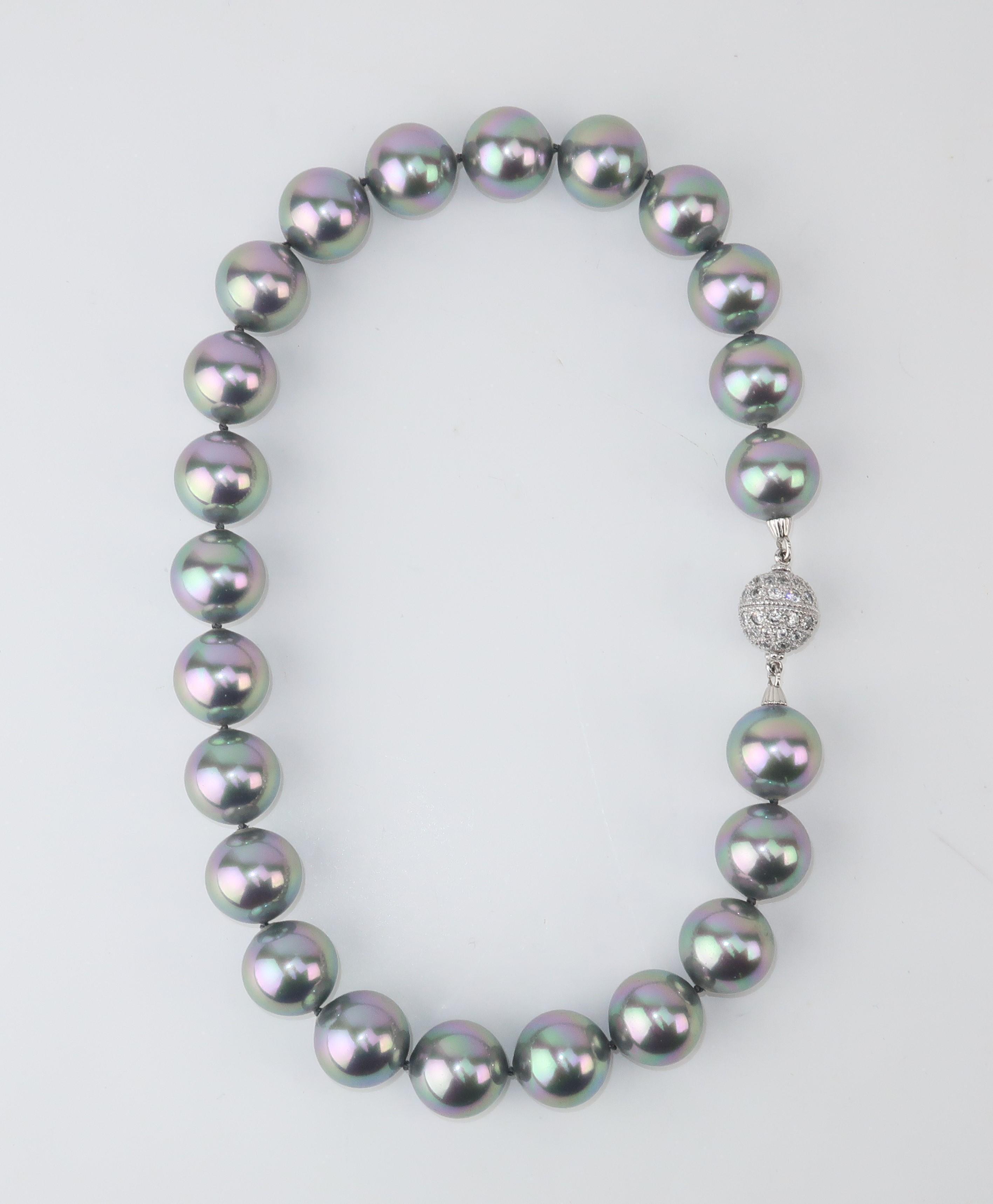 Faux fabulous!  A classy string of large faux gray pearls with a crystal rhinestone encrusted closure.  The pearls have a beautiful luster with just a hint of pink perfect for adding a soft glow.  The inside of the closure appears to be marked '925'