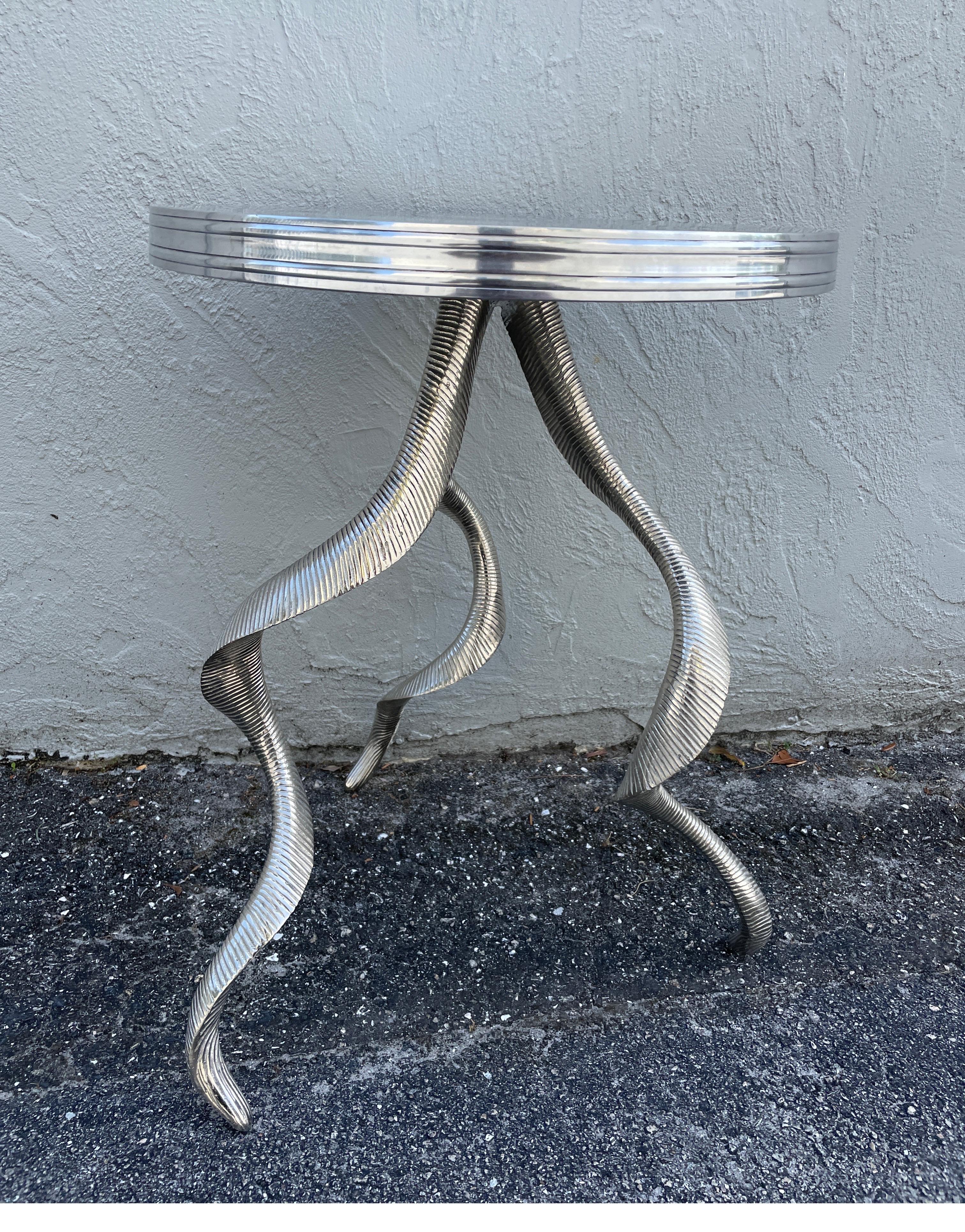 Vintage aluminum gueridon with faux horn legs. Will make a unique addition to any setting. Perfect drinks table.