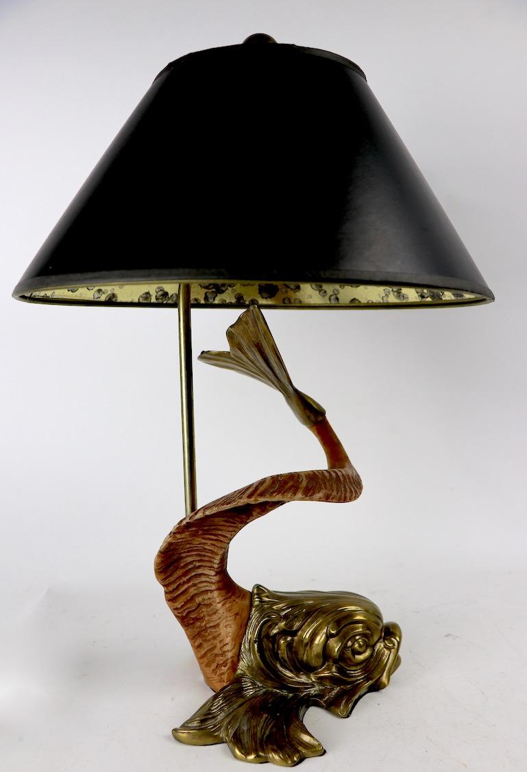 Fantasy sea creature with faux horn (resin) body. This example is in very good original condition, working, clean and ready to use. The lamp has two pull chain operated sockets, it accepts standard size screw in bulbs, and is marked chapman, and