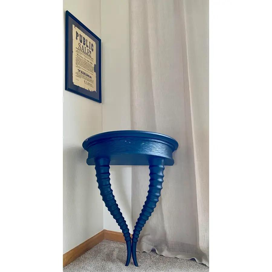 Unique, faux-horn, wall-mounted, semi-circular, console table with new matte black finish.

Excellent structural condition; flaking and cracked finish.

Dimensions
29ʺW × 16ʺD × 31.5ʺH