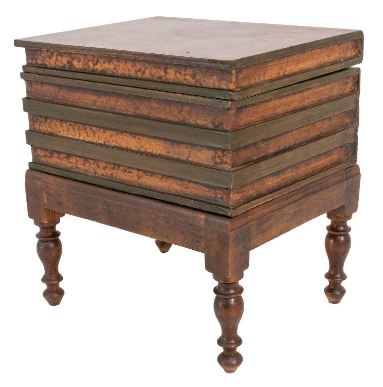 Faux leather bounded books secret box, group of four large brown books with red detailing to spine, mounted as an wood side table raised on four tapered turned wood legs.

Dealer: S138XX