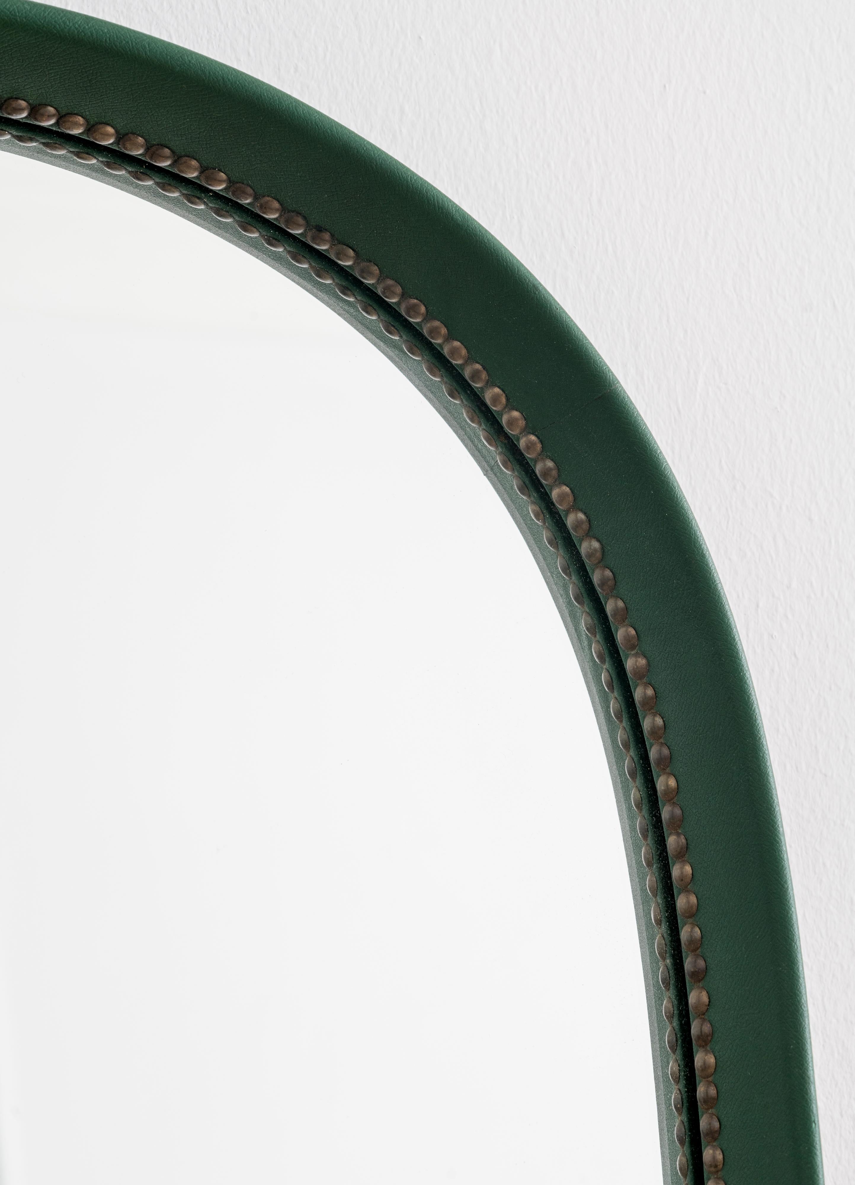 Artificial green leather mirror with brass nails

Designed by Otto Schulz and produced by Boet 

Maker's metal label on back.

 