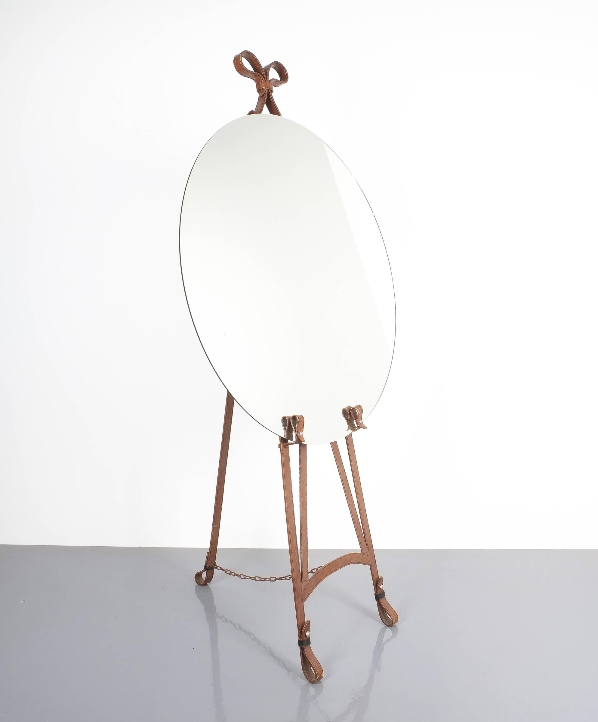Rare Ferblanterie easel, unique piece

Faux leather wrought iron Easel, France, circa 1950. Very unusual easel made from lacquered iron that depicts a leather-like surface. The ring in the middle is made from aluminum. Measure: Height is 63.77“. It